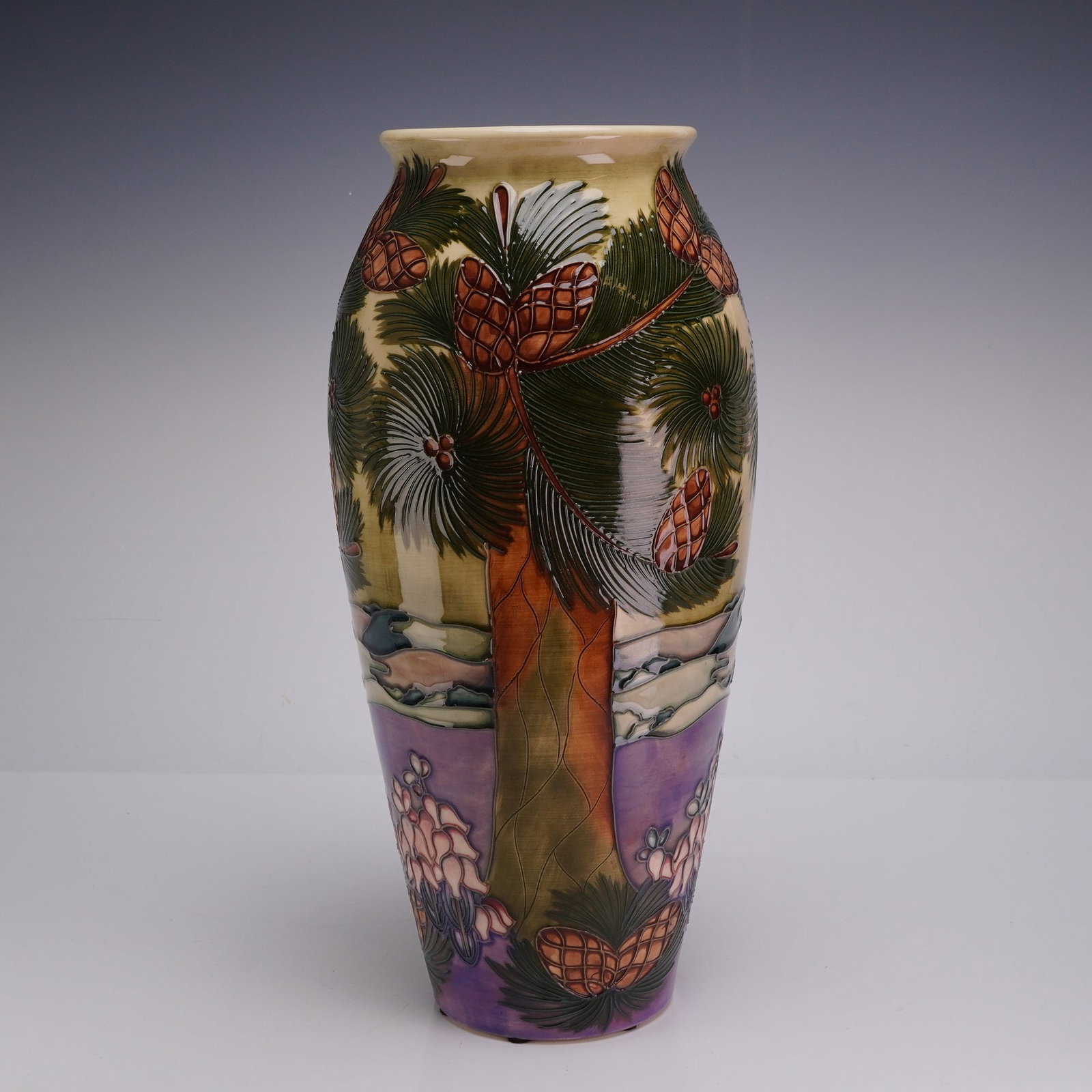 Moorcroft Pottery by Rachel Bishop Vase, Furzy Hill 1997: This earthenware piece features a hand-painted underglaze landscape with tubelined outlines creating a raised texture. The decoration depicts a pine forest motif with tall trees, dense green needles, 