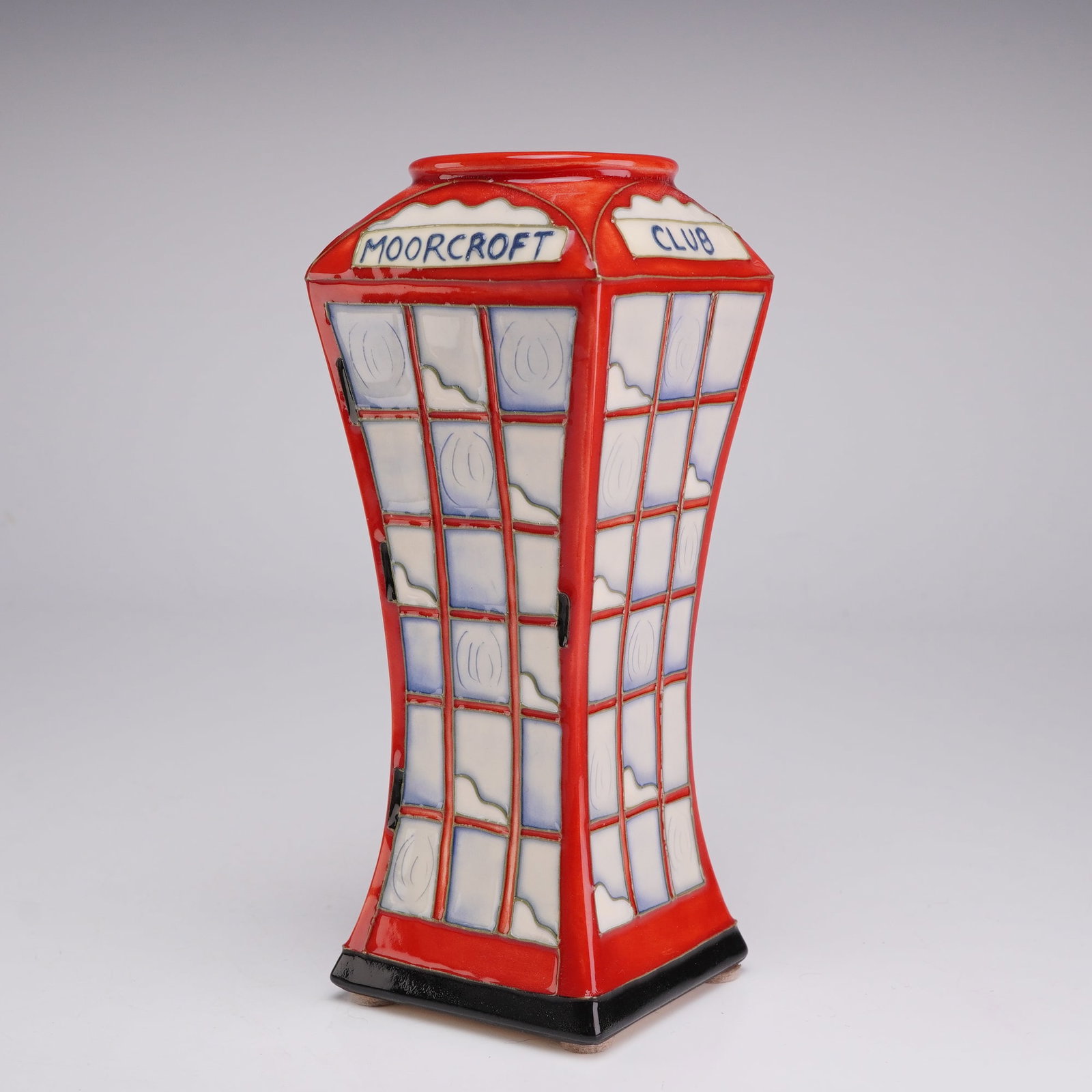 Moorcroft Pottery Collectors Club Vase, Telephone Box: The piece is designed as a stylized representation of a classic British red telephone kiosk. The tubelined decoration features the distinctive red body of the kiosk with windowpanes finished in shaded