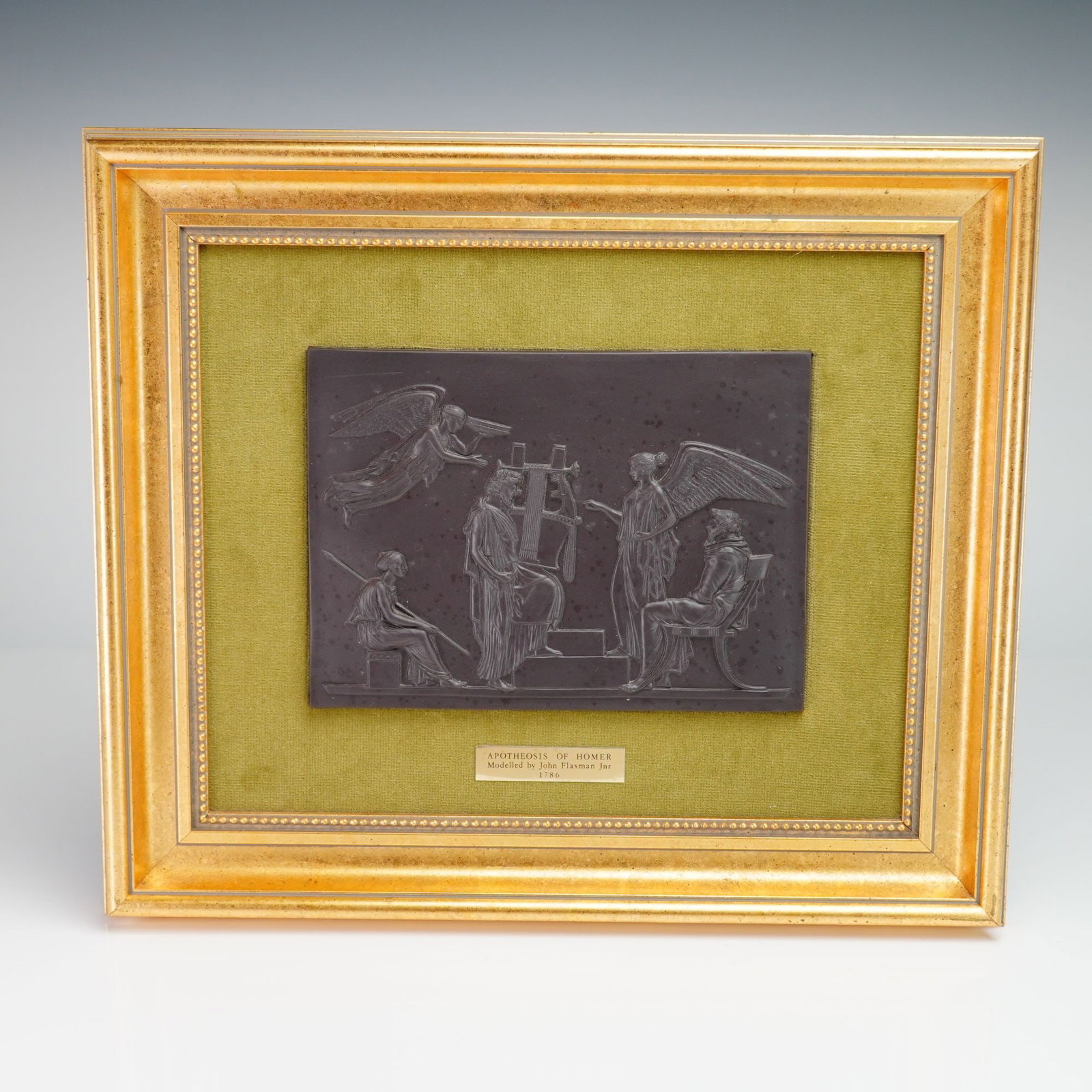 Framed Wedgwood Black Basalt Apotheosis of Homer Plaque: This rectangular black basalt stoneware plaque by Wedgwood depicts the Apotheosis of Homer. The relief-molded design is based on the 1786 model by John Flaxman Jr., featuring a central figure of Homer