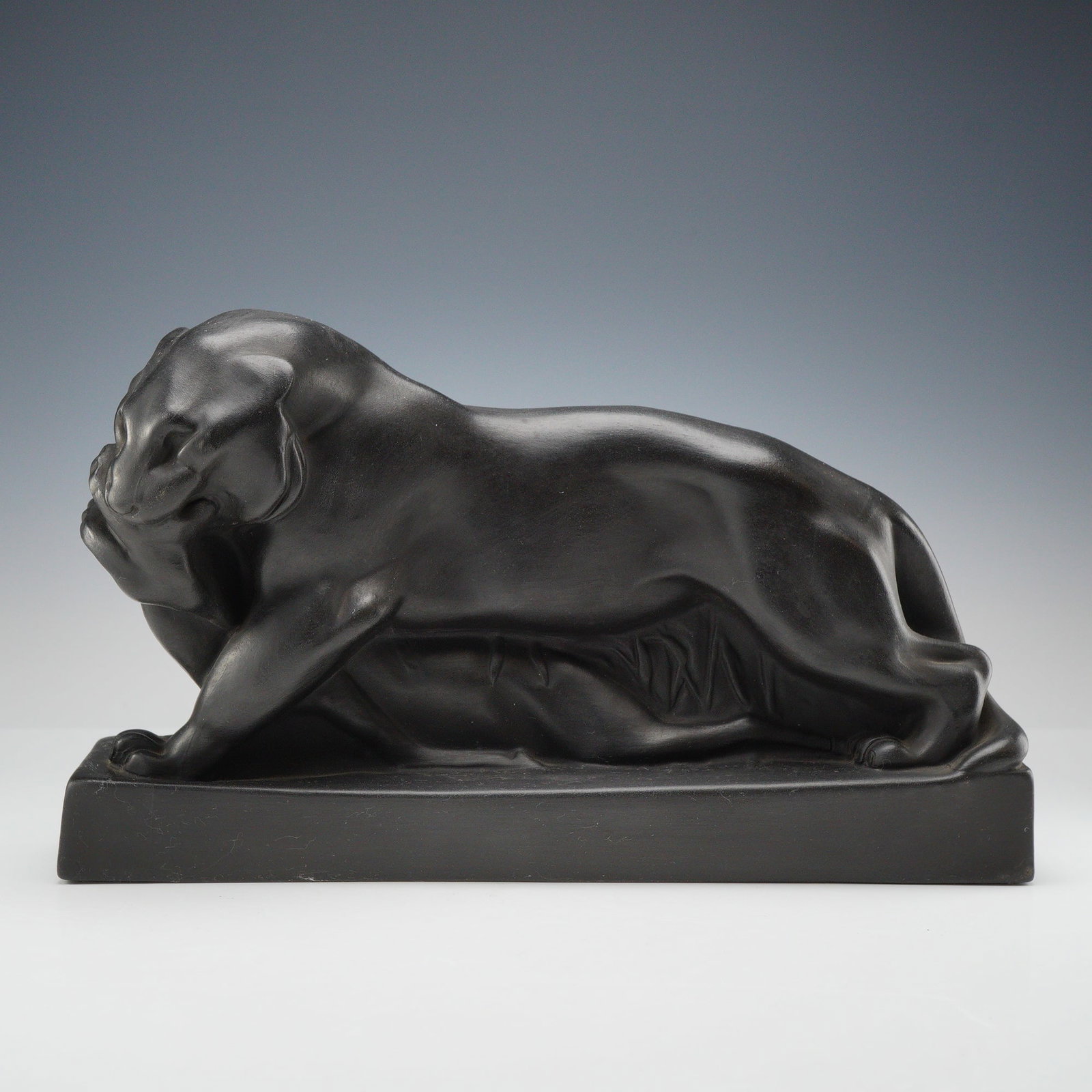 Wedgwood Black Basalt Art Deco Tiger and Buck Sculpture by John Skeaping: A Wedgwood black basalt Art Deco sculpture titled Tiger and Buck, designed by artist John Skeaping. The piece is part of the Rubin Collection and depicts a stylized, powerful tiger in a low-slung, cro