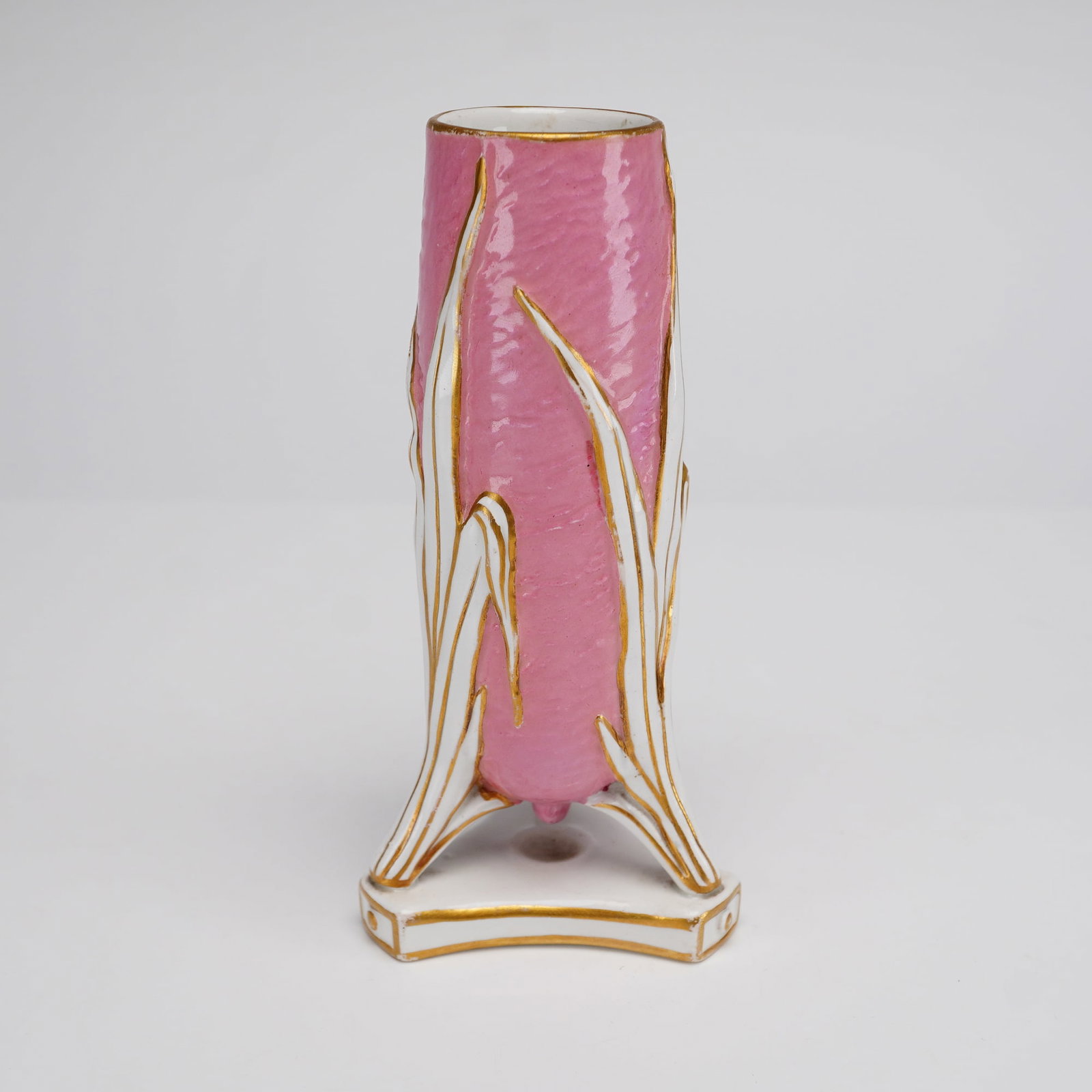 Wedgwood Pink Shagreen Textured Porcelain Bud Vase, c.1869: This Victorian-era porcelain bud vase was manufactured by Wedgwood and features a cylindrical body with a textured, mottled pink glaze resembling shagreen or hammered metal. The vessel is decorated wi