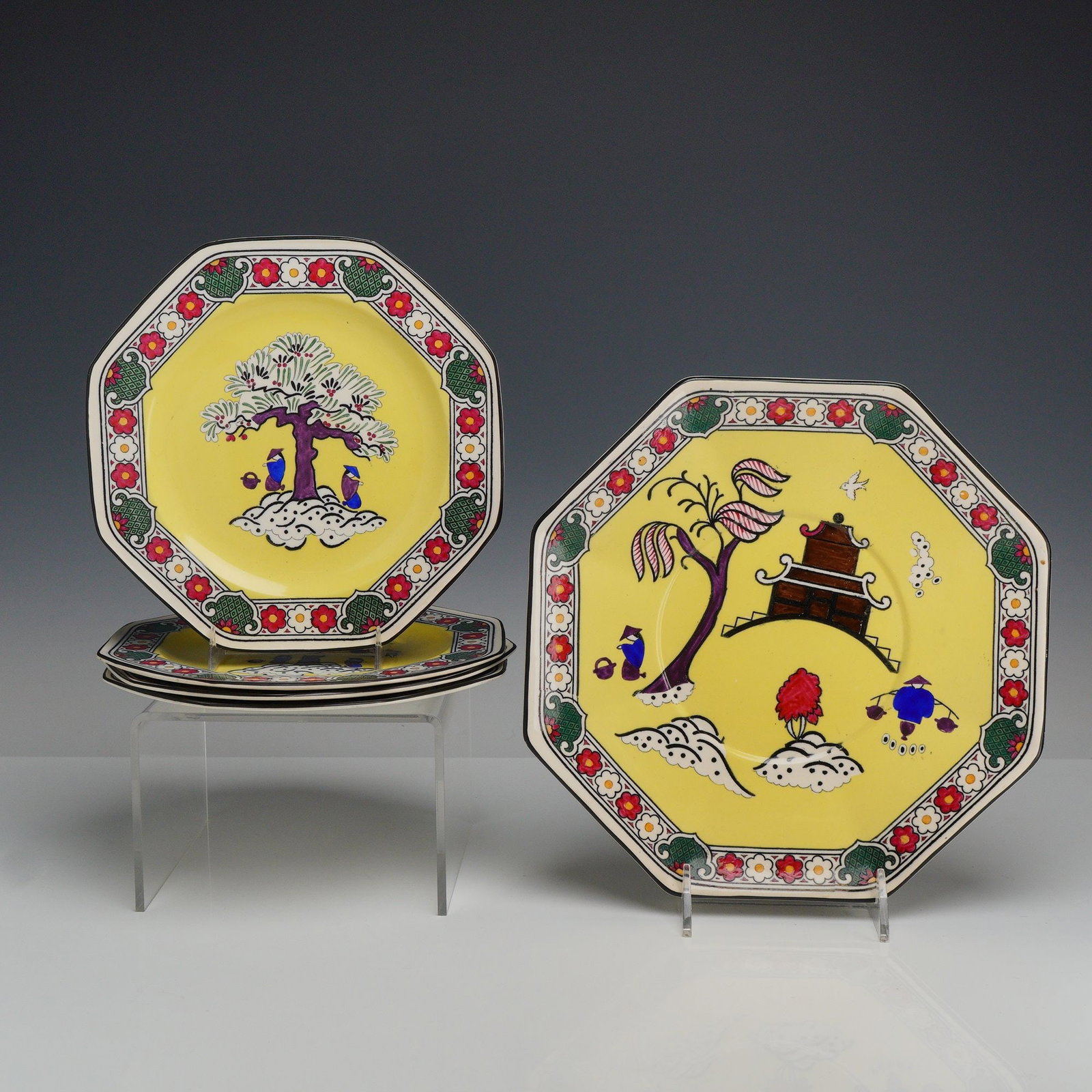 5pc Wedgwood Etruria Octagonal Chinoiserie Plates: A set of octagonal dessert or salad plates manufactured by Wedgwood (WW) at the Etruria works in England. These earthenware plates feature a Chinoiserie pattern on a bright yellow ground, identified b