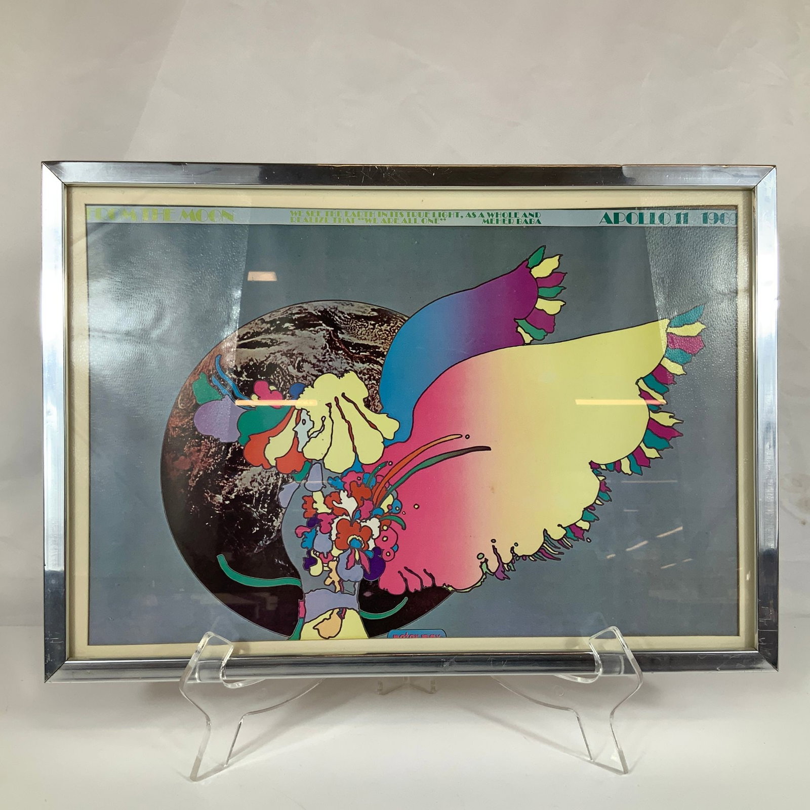 Peter Max Apollo 11 Number Two Framed Moon Landing Poster: This offset lithograph poster by Peter Max, titled Apollo 11 Number Two, commemorates the 1969 moon landing in the artist's signature psychedelic pop art style. The central composition depicts a multi