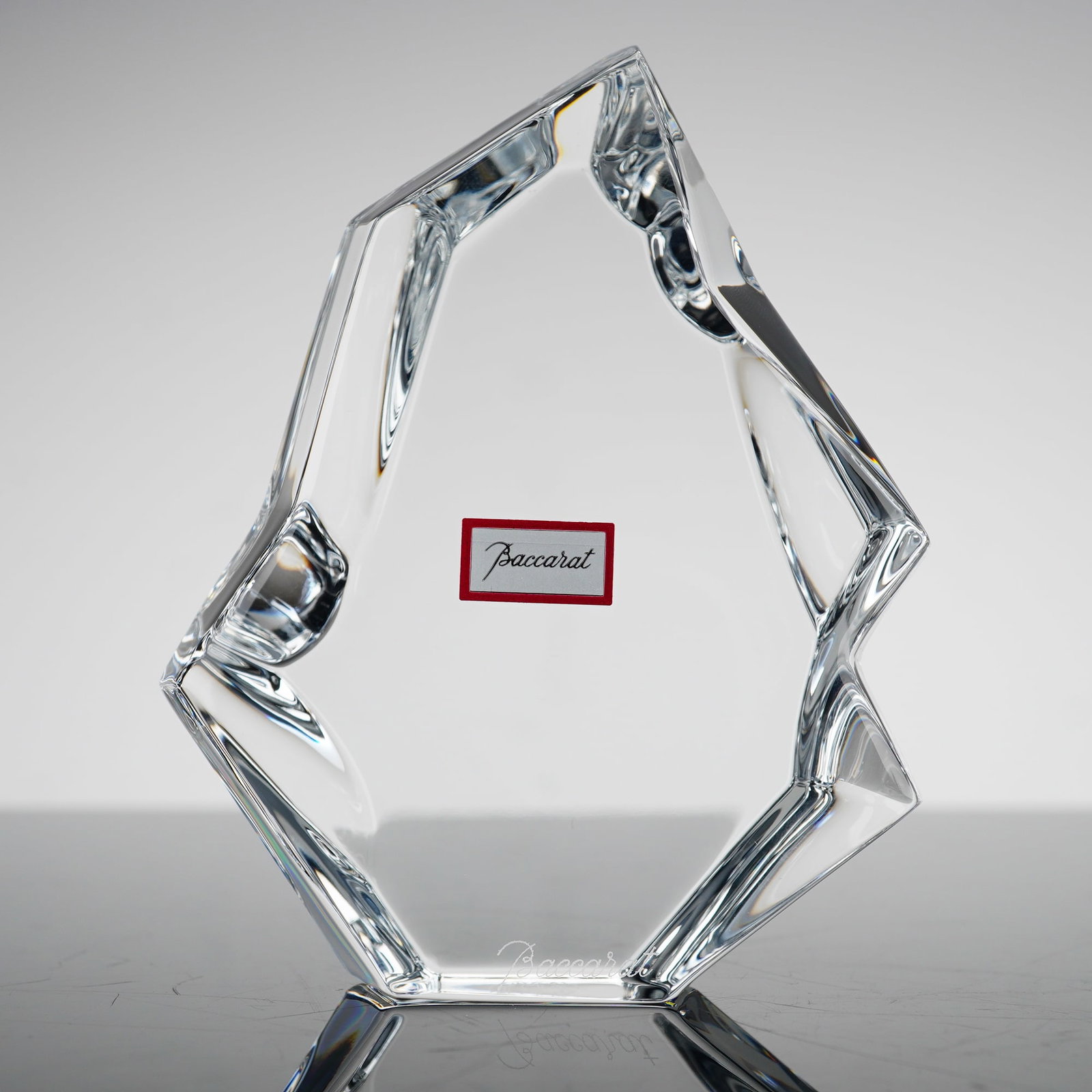 Baccarat France Crystal Iceberg Sculpture with Original Box: This is a modern, abstract clear lead crystal sculpture titled Iceberg, produced by the French glassmaker Baccarat. The piece features a jagged, geometric form with multiple polished facets designed t