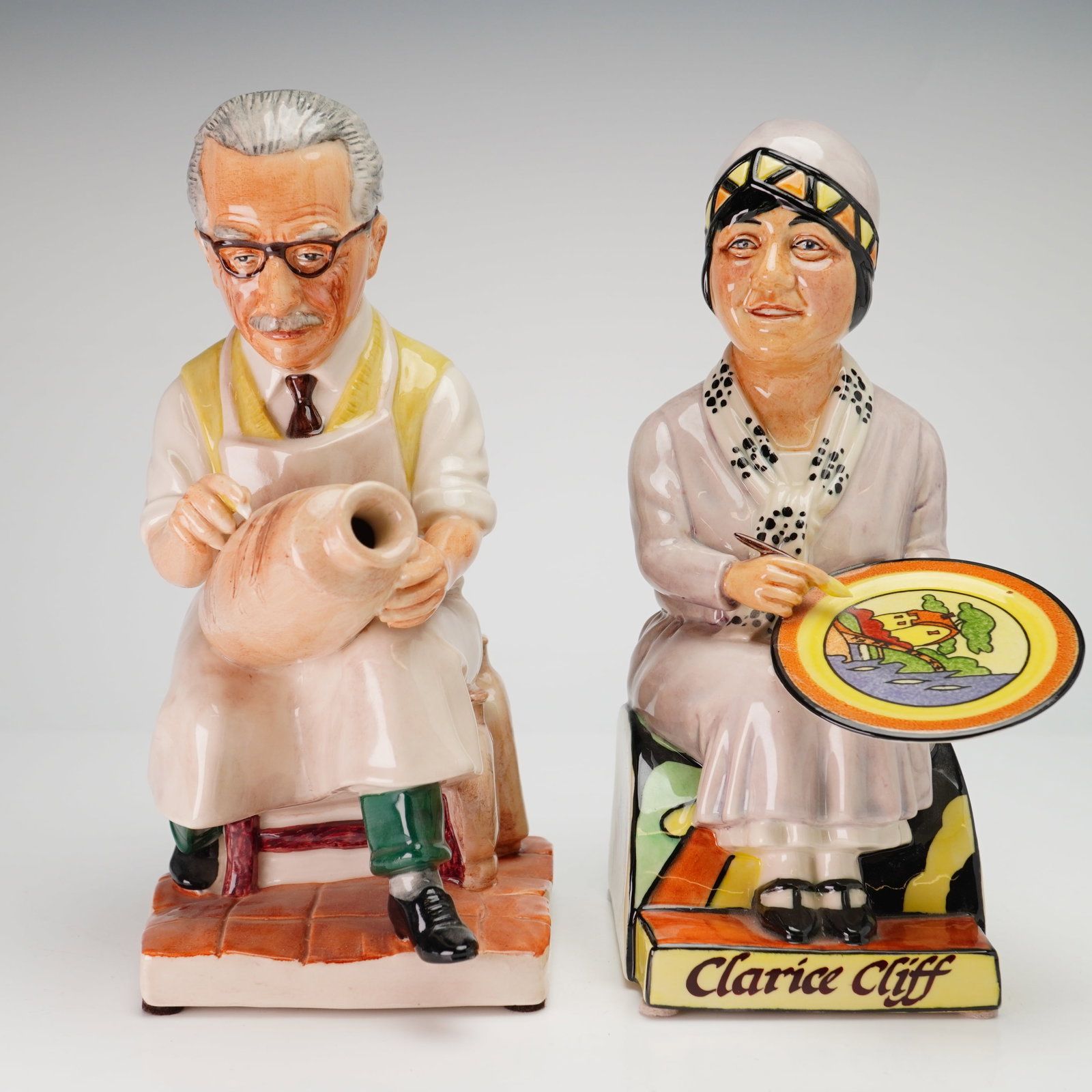 Two Kevin Francis Ceramics Limited Edition Toby Jugs Bernard Leach and Clarice Cliff: Both figurines were modeled by artist Douglas V. Tootle and depict two of the most influential figures in 20th-century British pottery. The first figure depicts Bernard Leach, often referred to as the