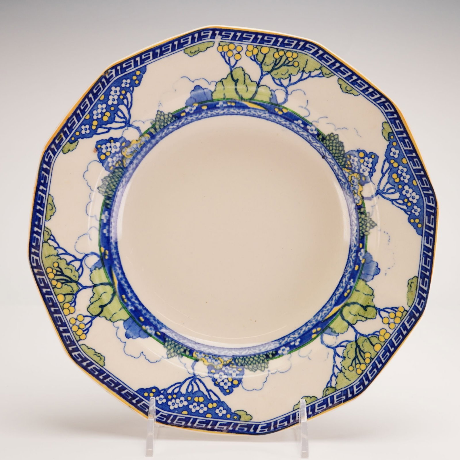Royal Doulton Octagonal Large Rim Soup Bowl, Merryweather Pattern: This Royal Doulton earthenware soup plate features the Merryweather pattern, a stylized Art Deco-influenced landscape design. The octagonal vessel is constructed with a wide rim and a circular central