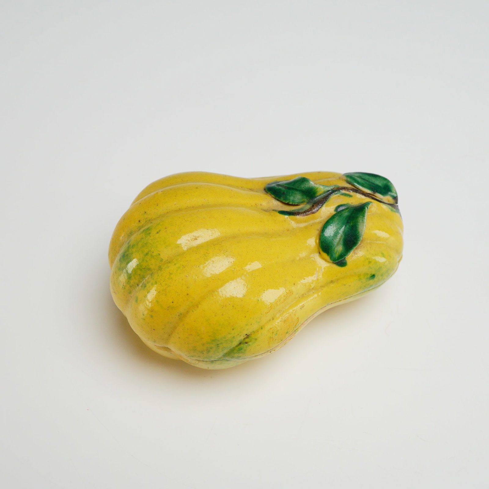 Chinese Porcelain Squash Jewelry Box: This two-part ceramic lidded box is realistically modeled in the form of a lobed squash, designed as a decorative jewelry box. The exterior is finished with a vibrant yellow lead glaze featuring green