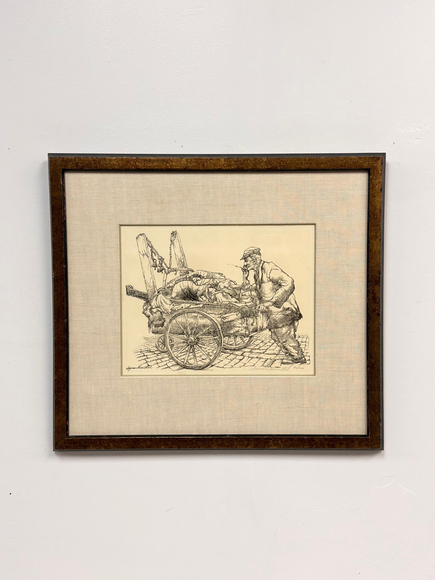 Seymour Rosenthal (American 1921-2007) Lithograph, The Junk Vendor: This lithograph on paper by American artist Seymour Rosenthal (1921-2007) is titled The Junk Vendor. The composition depicts a street peddler in profile, wearing a flat cap and smoking a pipe while pu