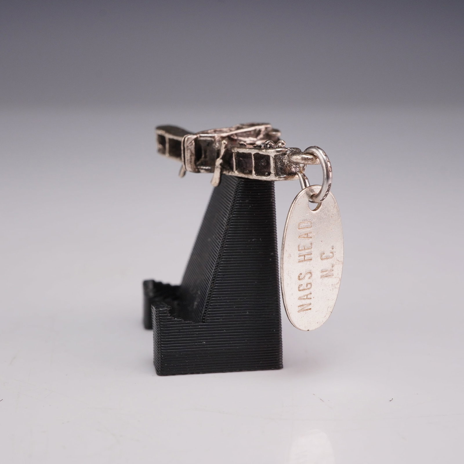 Beaucraft Sterling Silver 3D Wright Flyer Biplane Souvenir Charm Nags Head NC: This is a vintage sterling silver souvenir charm depicting the Wright Flyer biplane in a three-dimensional model. The piece features a detailed miniature aircraft with openwork wings, vertical and