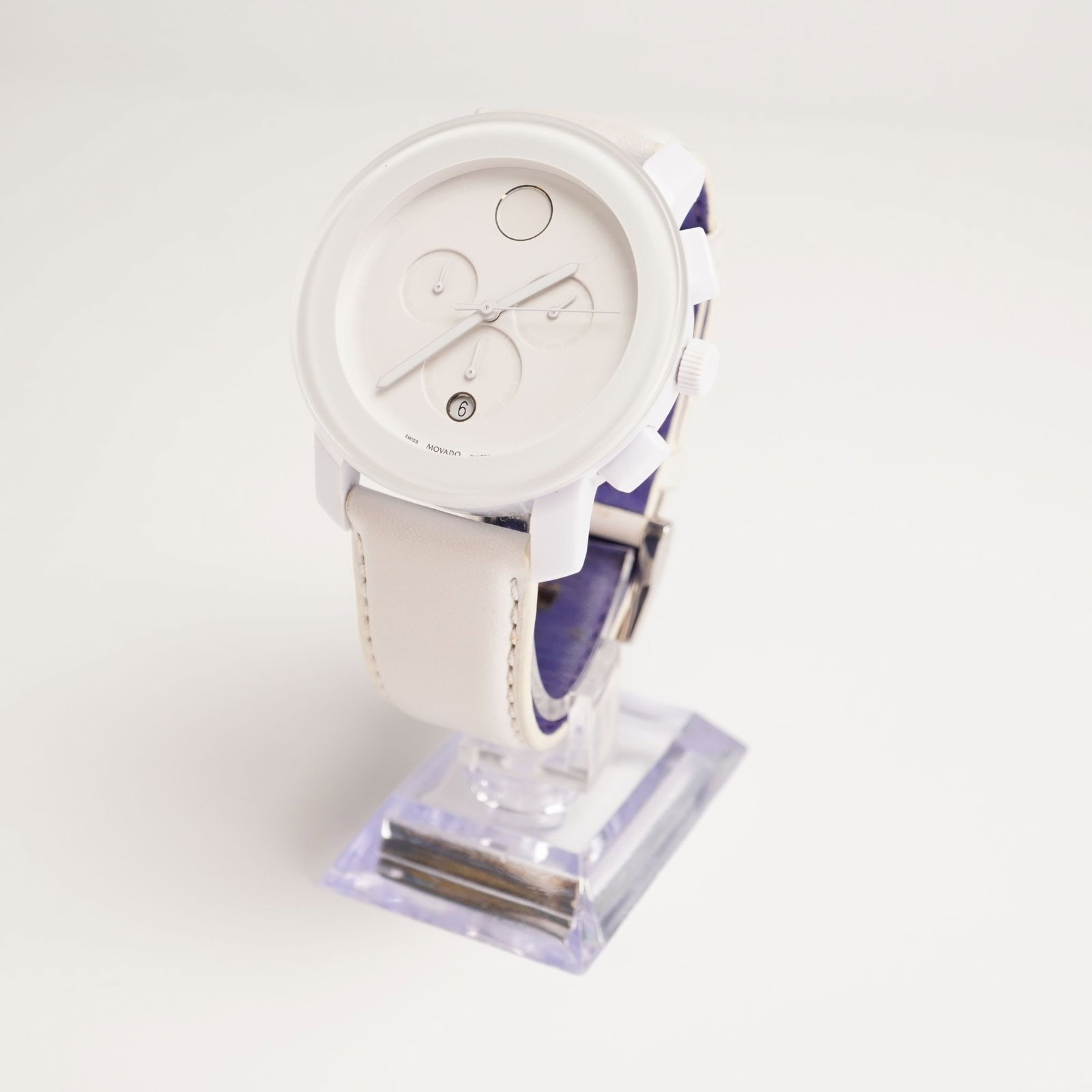 Movado Bold Men's Stainless Steel Watch, White: White on white with white hands; stainless steel; water resistant; Swiss movement; white leather band; 10842402; Movado Bold etched mark on reverse. Dimensions: 9.5"L Weight: 2.3 oz.