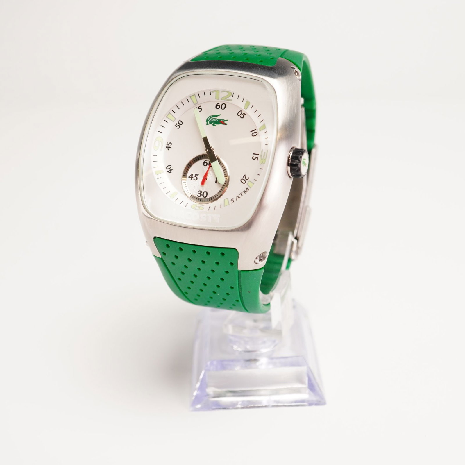 Lacoste Men's Chronograph Stainless Steel Watch, Green 2010328: Quartz analog movement; window date display; Mineral crystal; Green silicone strap; water resistant 5 ATM; Lacoste Crocodile etched mark on reverse. Dimensions: 8.5"L Weight: 4.6 oz.
