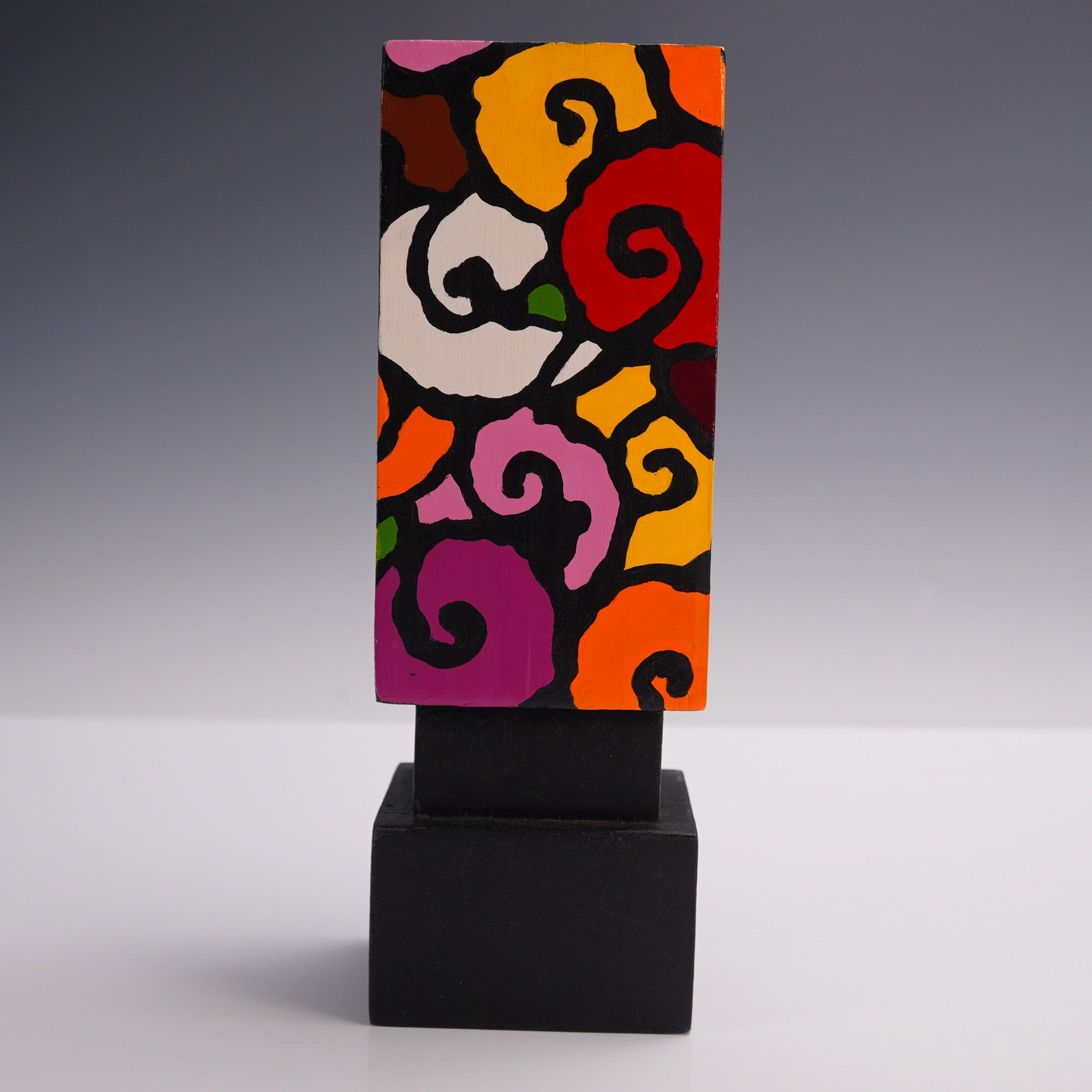 Floral Hand Painted Wood Sculpture, Artist Signed: Painted wooden sculpture featuring a vibrant floral motif in the style of pop art, possibly inspired by the visual style of Brazilian artist Romero Britto. The piece is rendered with bold black outlin