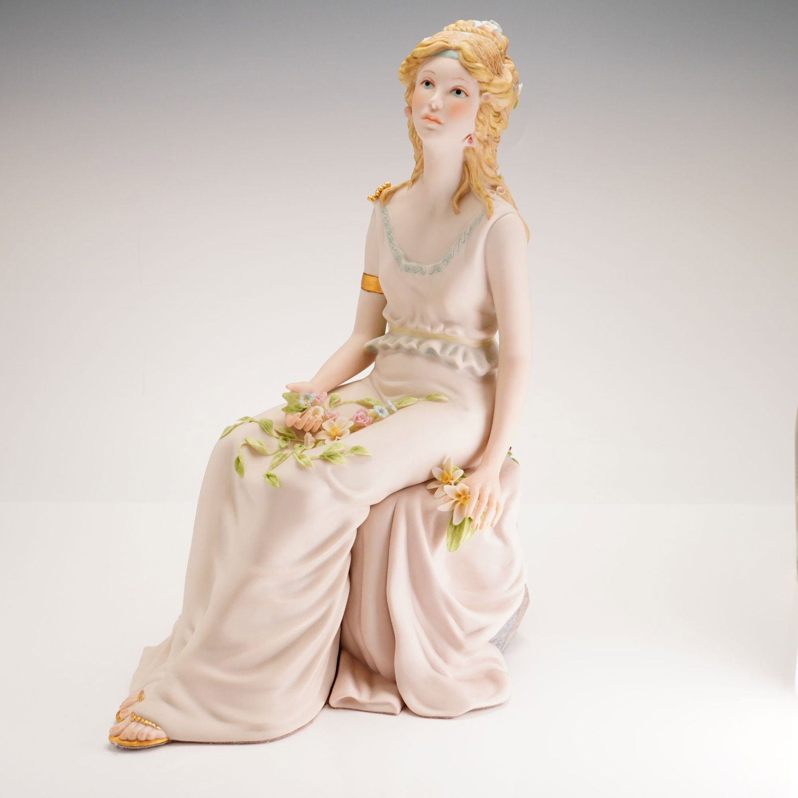 Cybis by William Pae Porcelain Sculpture, Persephone: Late 20th century Cybis Persephone bisque porcelain figure. Designed by William Pae in 1982. Sculpture depicts the Greek goddess seated, in pastel tones with Gilded accents. Cybis written mark on