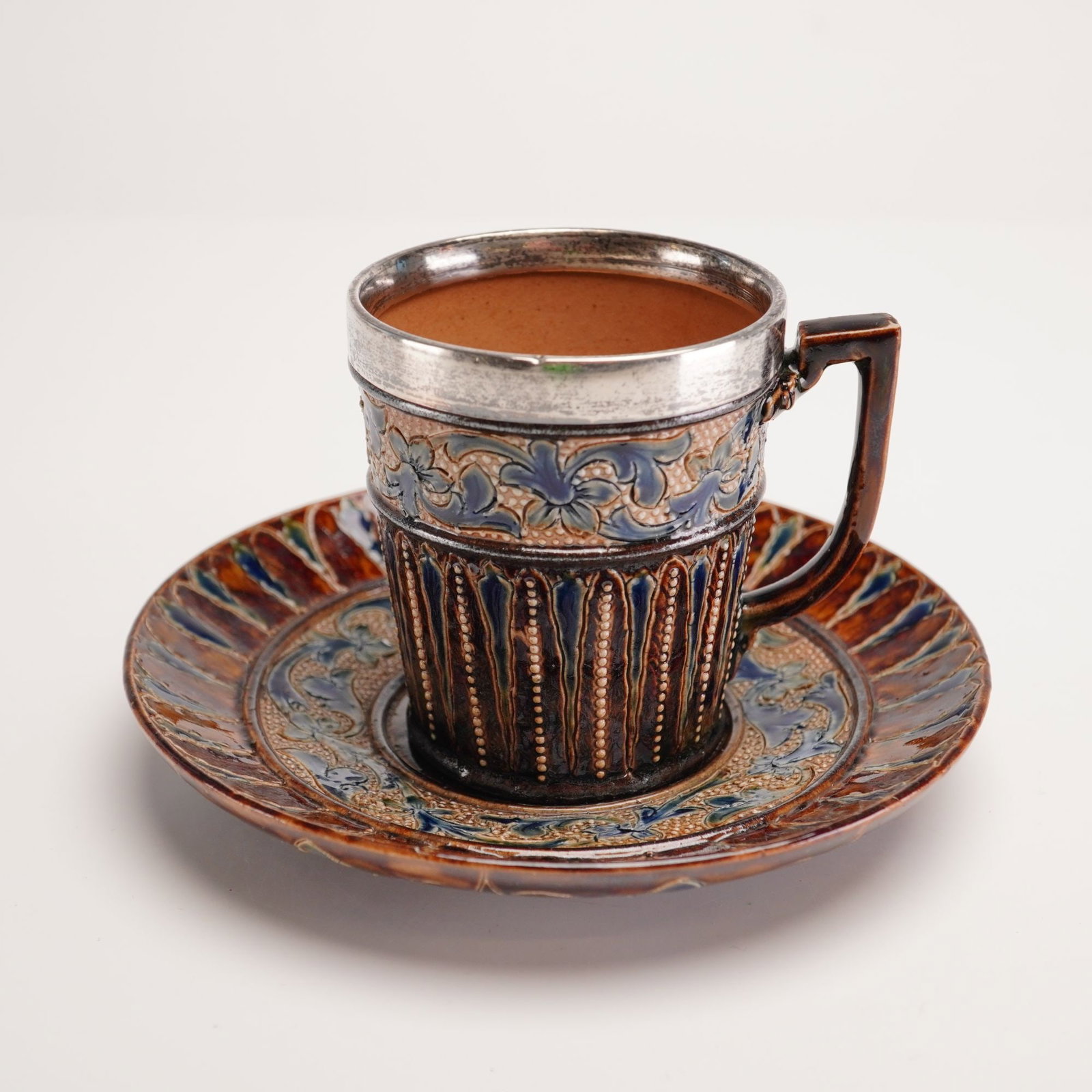 Doulton Lambeth Salt-Glazed Stoneware Cup and Saucer with Sterling Silver Rim, 1881 (1 of 4)