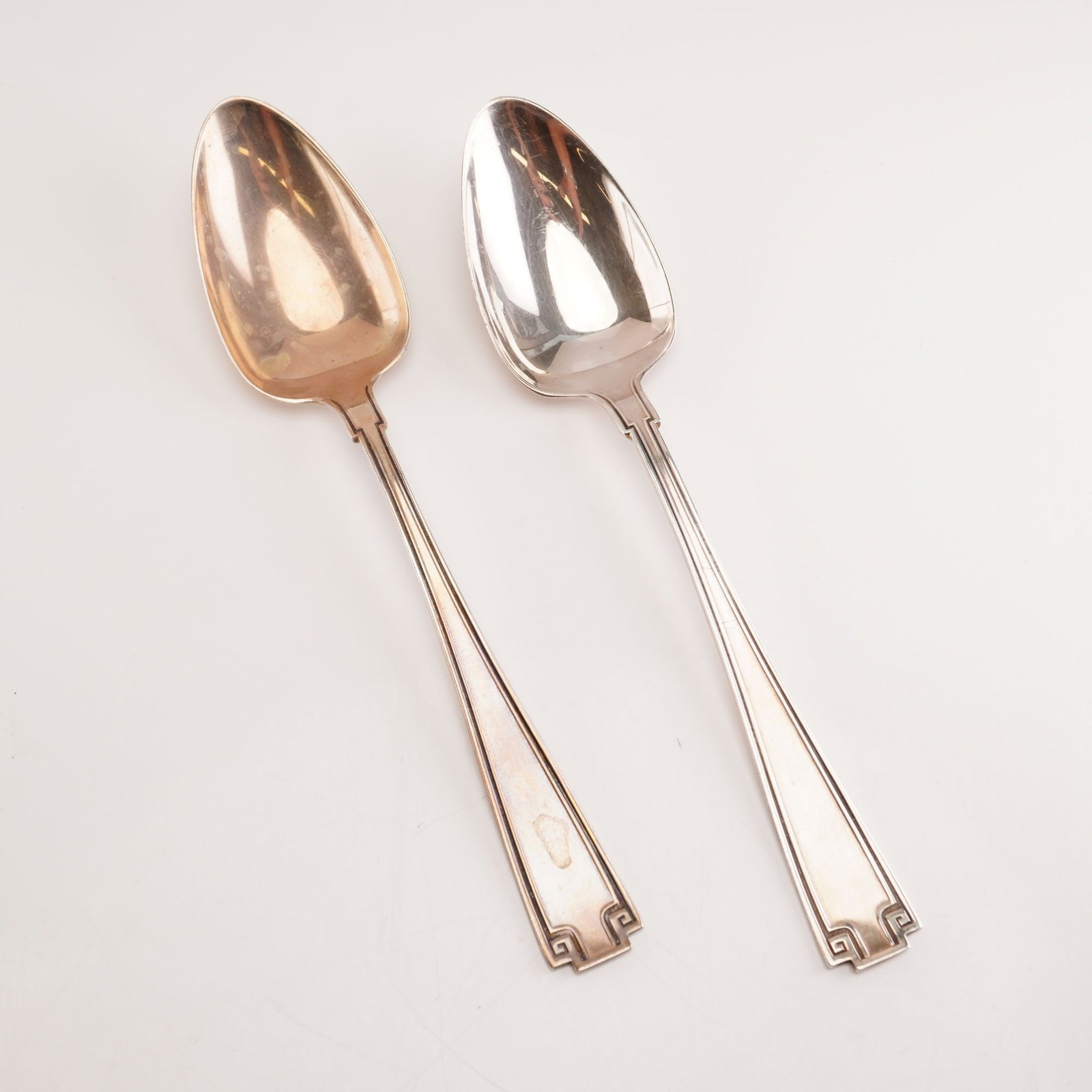 2pc Gorham Sterling Silver Teaspoons, Etruscan: Pair of sterling silver teaspoons in the Gorham Etruscan pattern, produced from 19131991. This design reflects a refined Greco-Roman revival style, highlighted by its balanced form and signature Greek