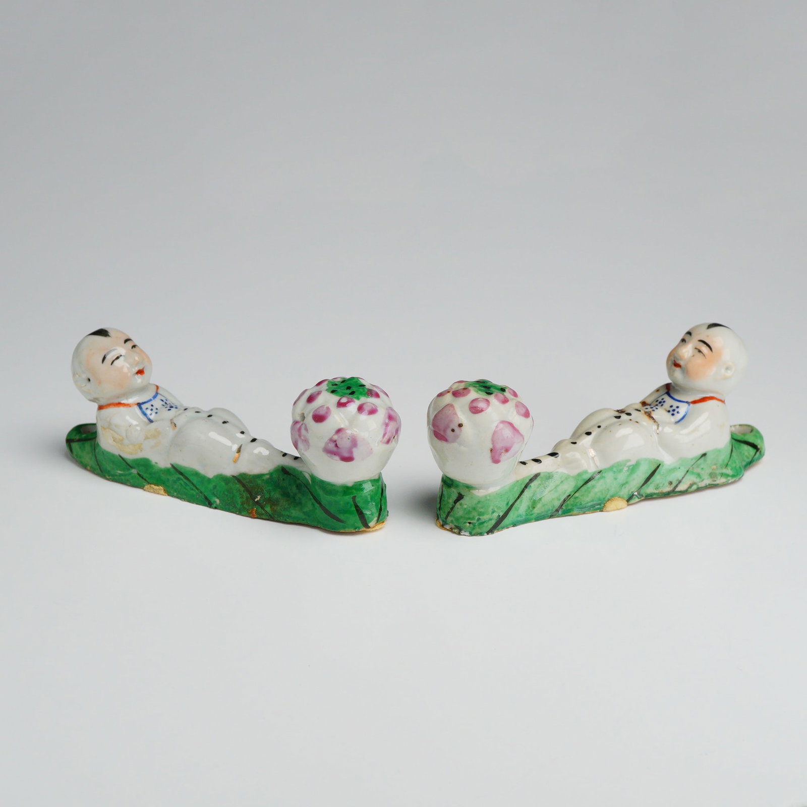 Pair of Chinese Hand-Painted Porcelain Reclining Children Brush Rests / Scroll Weights (1 of 3)
