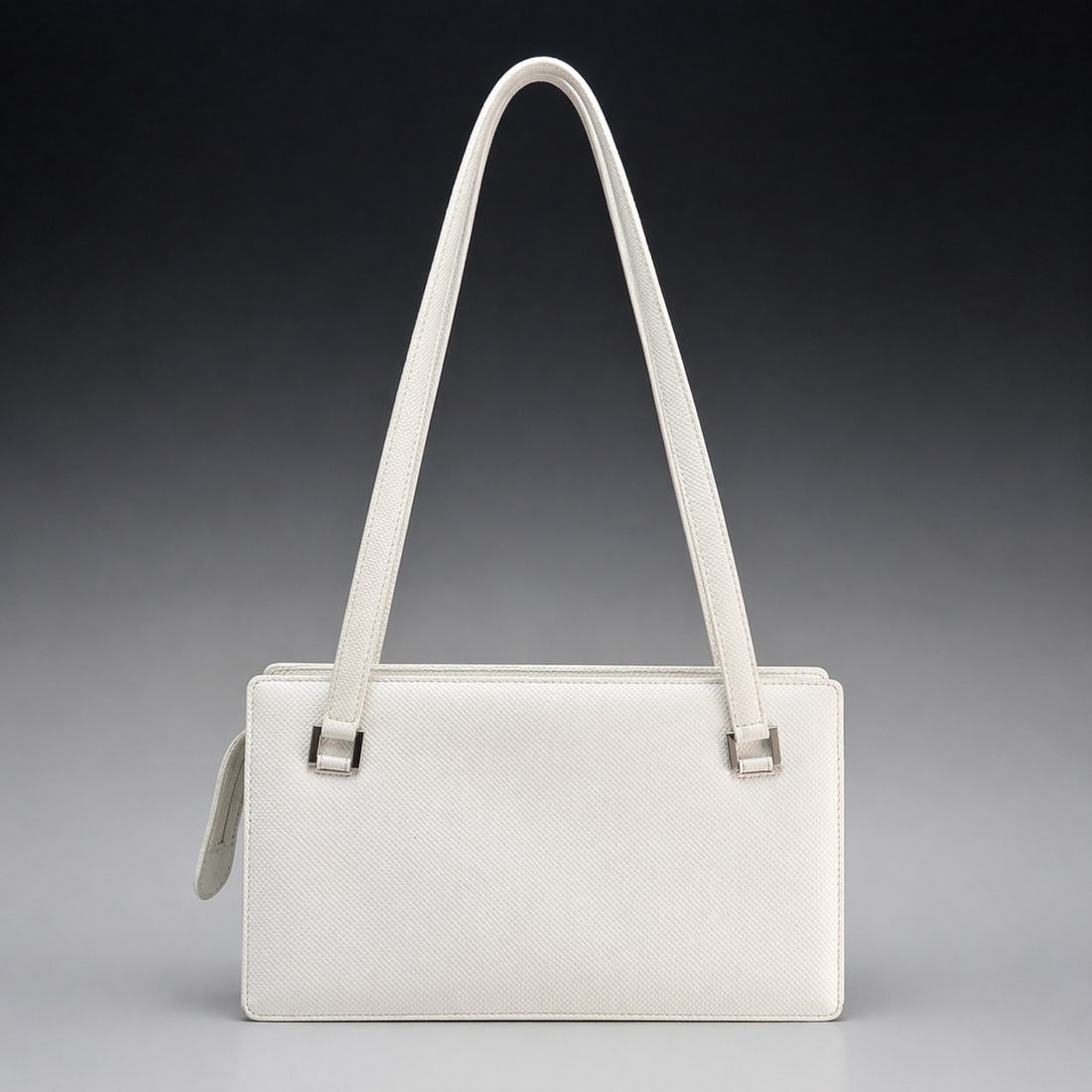Vintage Bottega Veneta White Textured Leather Structured Shoulder Bag: A vintage Bottega Veneta shoulder bag crafted from white textured leather with a cross-hatched finish. The bag features a structured rectangular body with long fixed-length shoulder straps secured by 