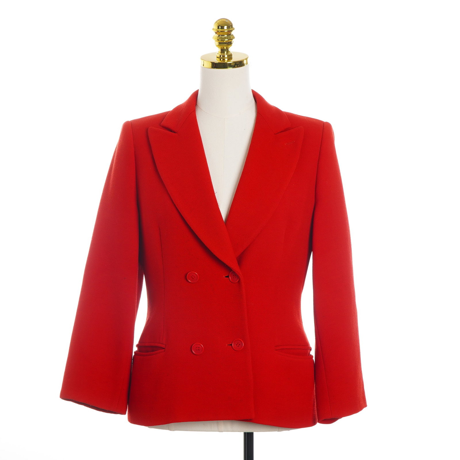 Giorgio Armani Borgonuovo Red Wool Double-Breasted Blazer: This vintage Giorgio Armani blazer is crafted from a vibrant red wool crepe fabric featuring a subtle pebbled texture. The garment is designed with a tailored silhouette, wide peaked lapels, and a