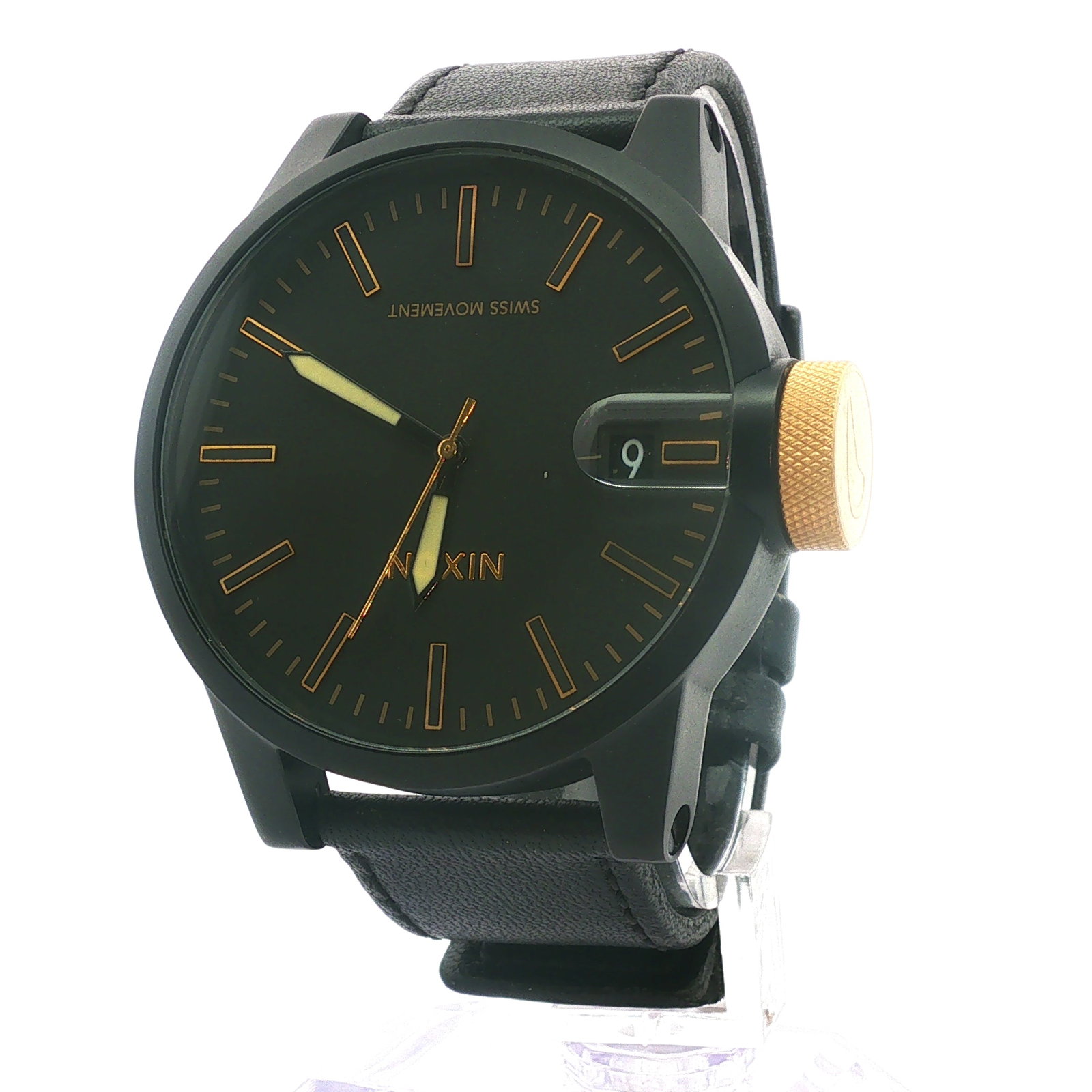 Nixon Magnified Men's Watch The Chronicle, Black Profile A127001: Modern men's watch in all black on black leather band; stainless steel; 100 m water resistant; Nixon Magnified The Chronicle impressed on reverse. Dimensions: 10"L Weight: 3.2 oz.
