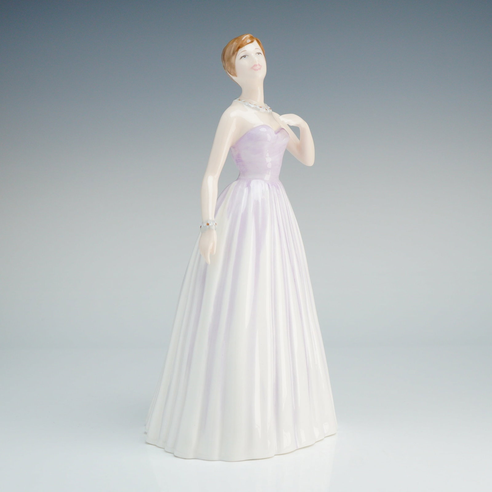 Royal Doulton Classics Samantha Bone China Figurine HN 4403: This Royal Doulton Classics bone china figurine, titled Samantha (HN 4403), was modeled by Nada M. Pedley. The hand-made and hand-decorated piece depicts a woman in a formal gown featuring a strapless