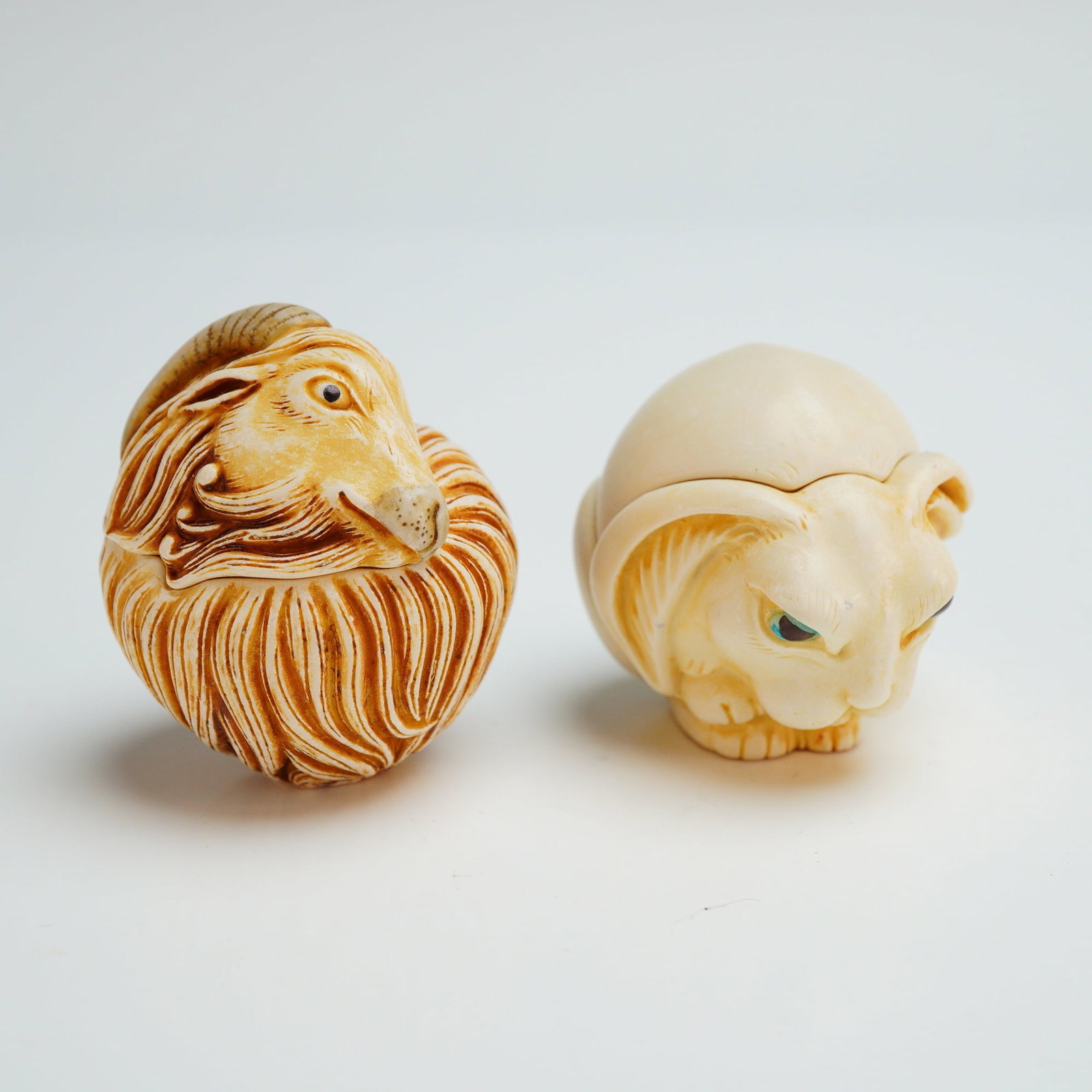 2pc Harmony Kingdom Roly Poly Box Figurines, Fergie & Gleason: Each piece is featuring a brown-wash finish to accentuate the carved surfaces. The Gleason figure depicts a ram with stylized fleece and horns, containing a line-drawing of a bird's leg on the interio