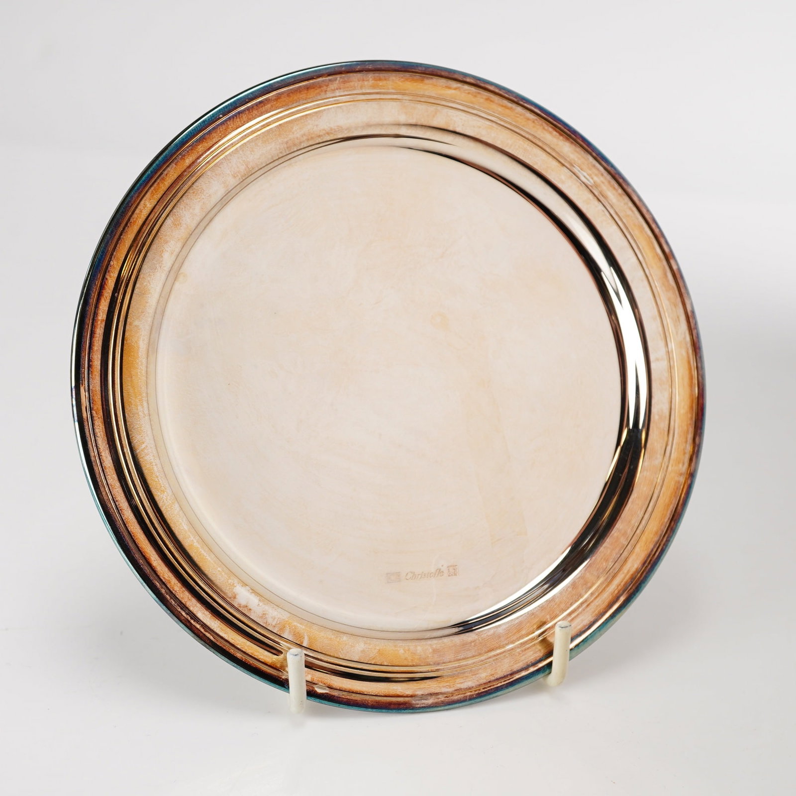 Christofle Albi Silver-Plated Charger: A silver-plated charger or large service plate manufactured by the French silversmith Christofle in the Albi pattern. The plate features a flat center well and a wide rim decorated with three concentr