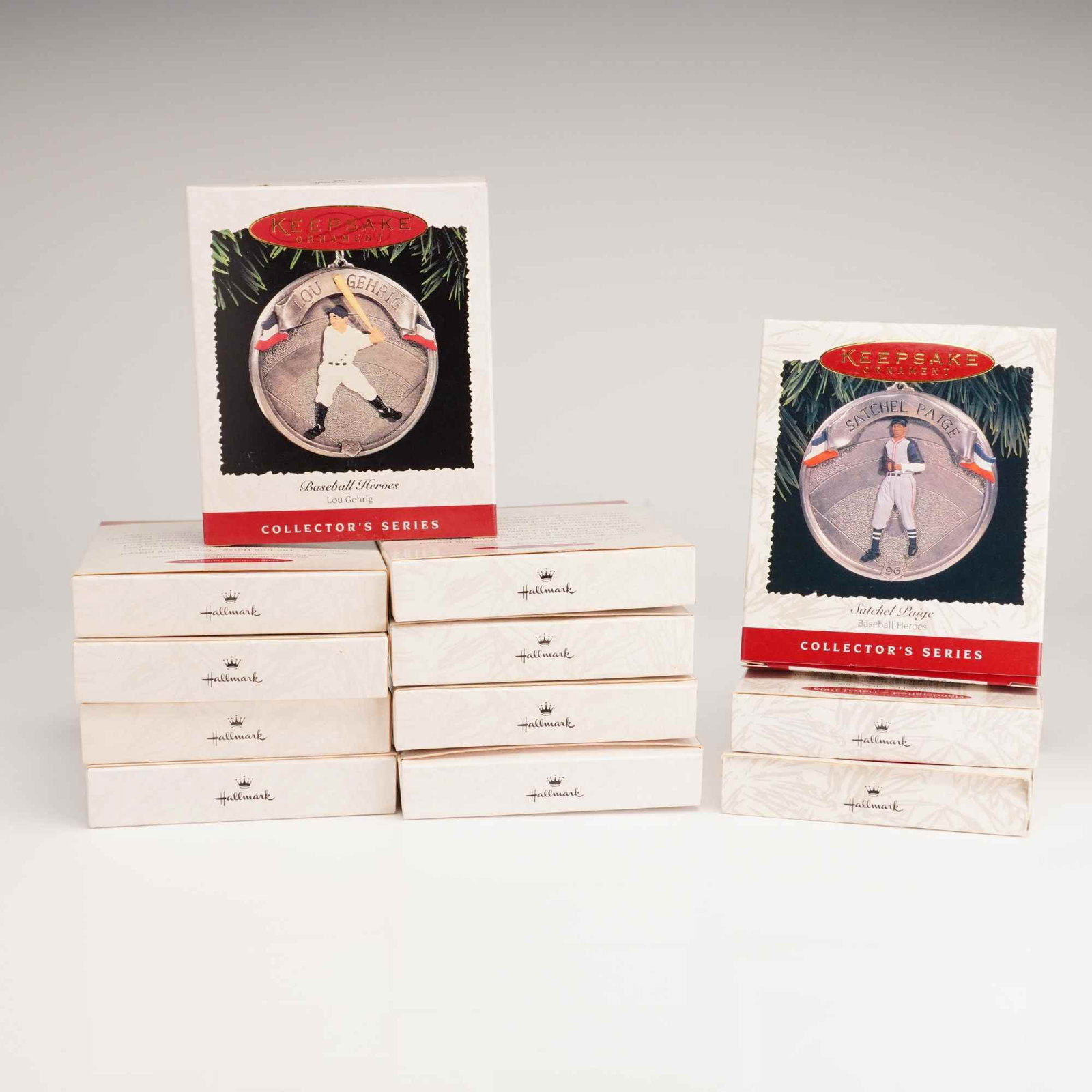 12pc Hallmark Keepsake Ornaments Baseball Heroes Series: This collection consists of 12 Hallmark Keepsake Ornaments from the Baseball Heroes collector's series. The lot contains multiple examples of two specific releases: the 1995 Lou Gehrig ornament,