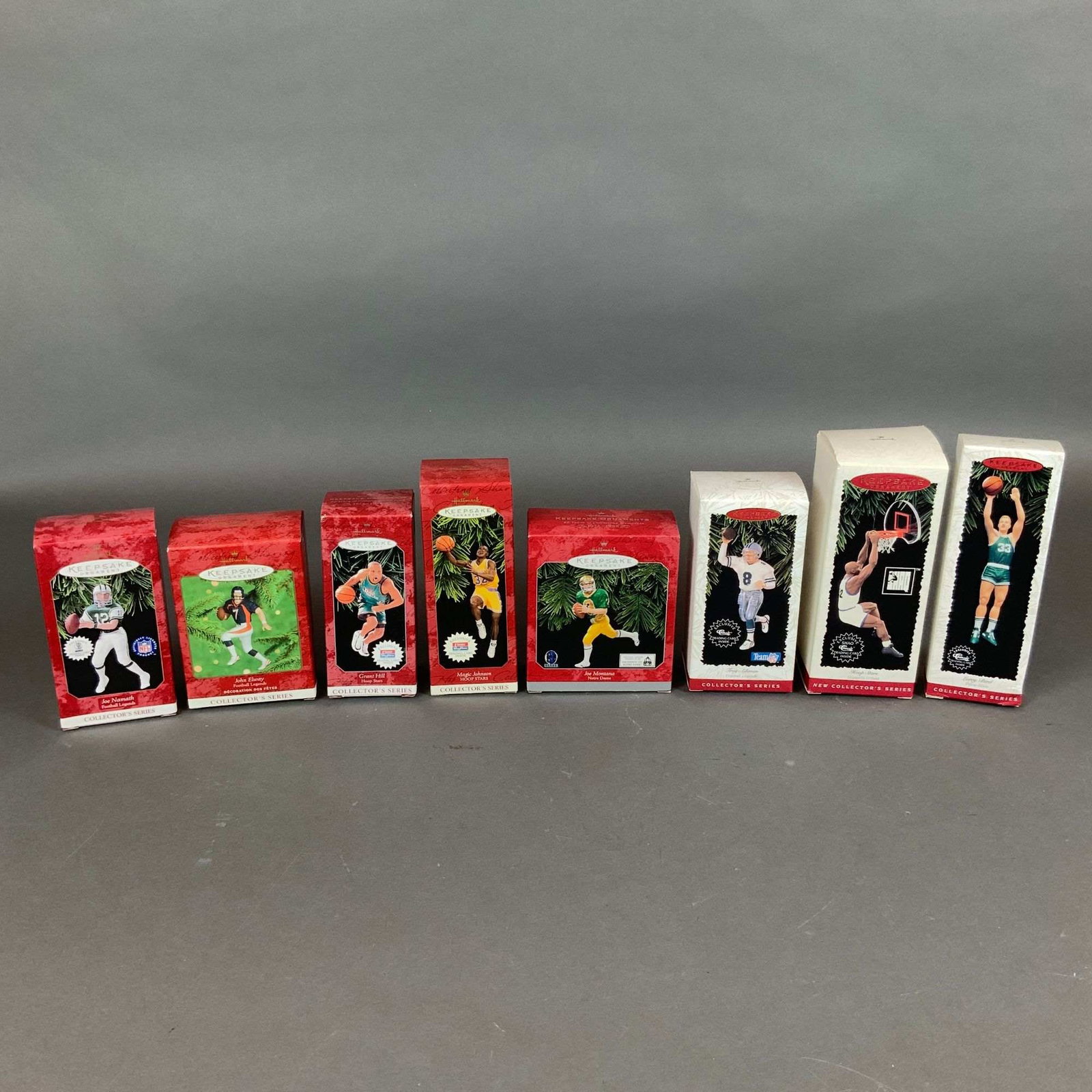 Lot of Eight Hallmark Keepsake Ornaments Sports Football Legends and Hoop Stars Series: A collection of eight vintage Hallmark Keepsake Ornaments from the Football Legends and Hoop Stars collector series, manufactured between 1995 and 2000. The lot consists of four figures from the Footb