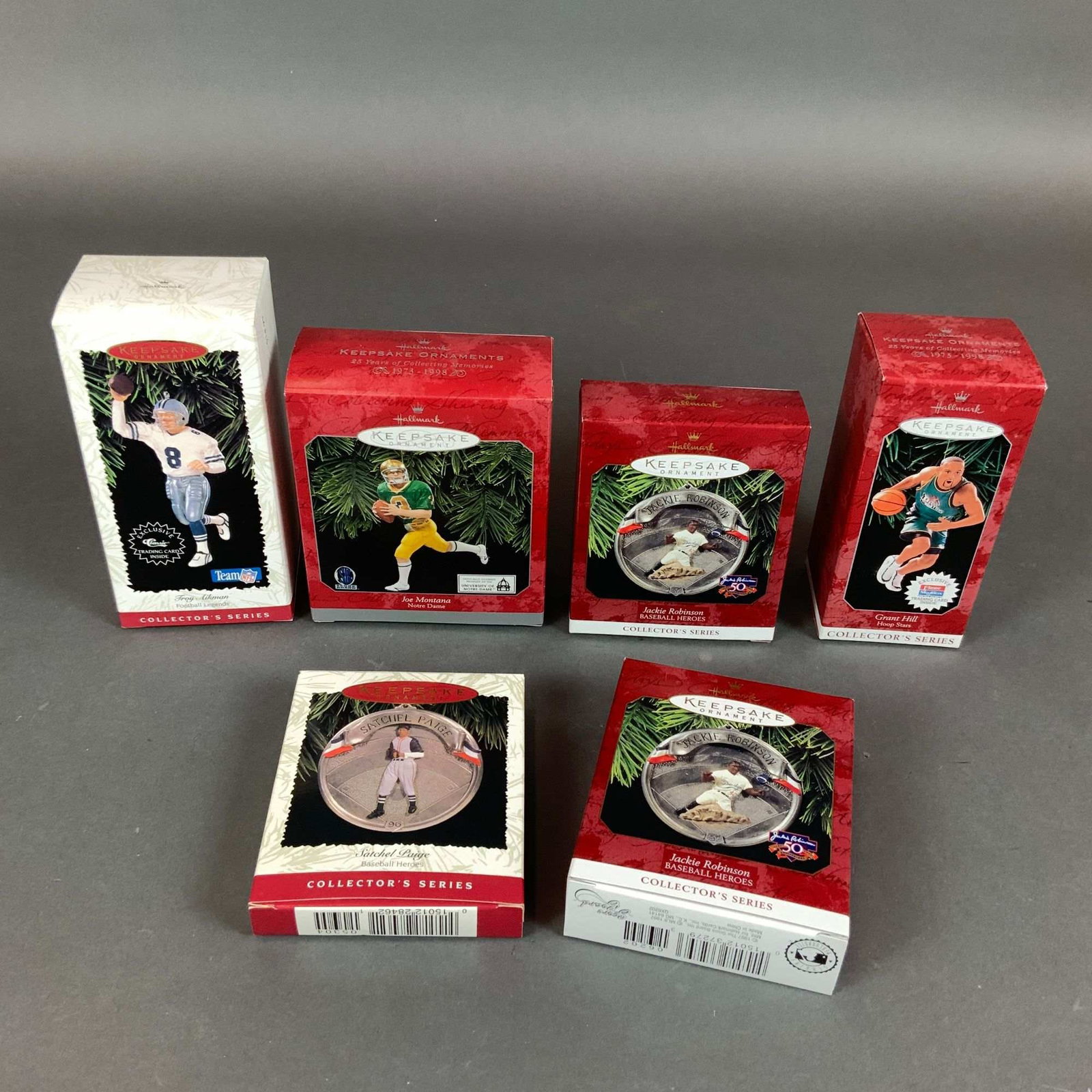 6pc Hallmark Keepsake Sports Ornaments Collection: A 6pc collection of Hallmark Keepsake sports-themed holiday ornaments from the Collector's Series, produced between 1996 and 1998. The group features five legendary professional athletes including Tro