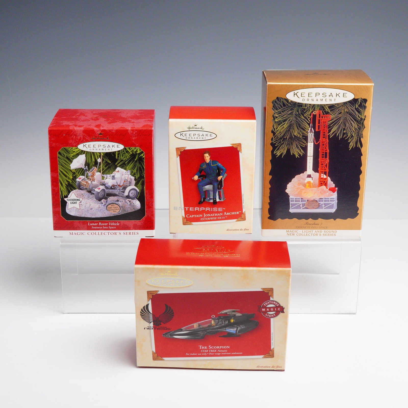 4pc Hallmark Keepsake Space Exploration and Star Trek Ornaments: This collection consists of four Hallmark Keepsake collectible ornaments, each housed in its original manufacturer packaging. The group includes two entries from the Journeys Into Space series and two
