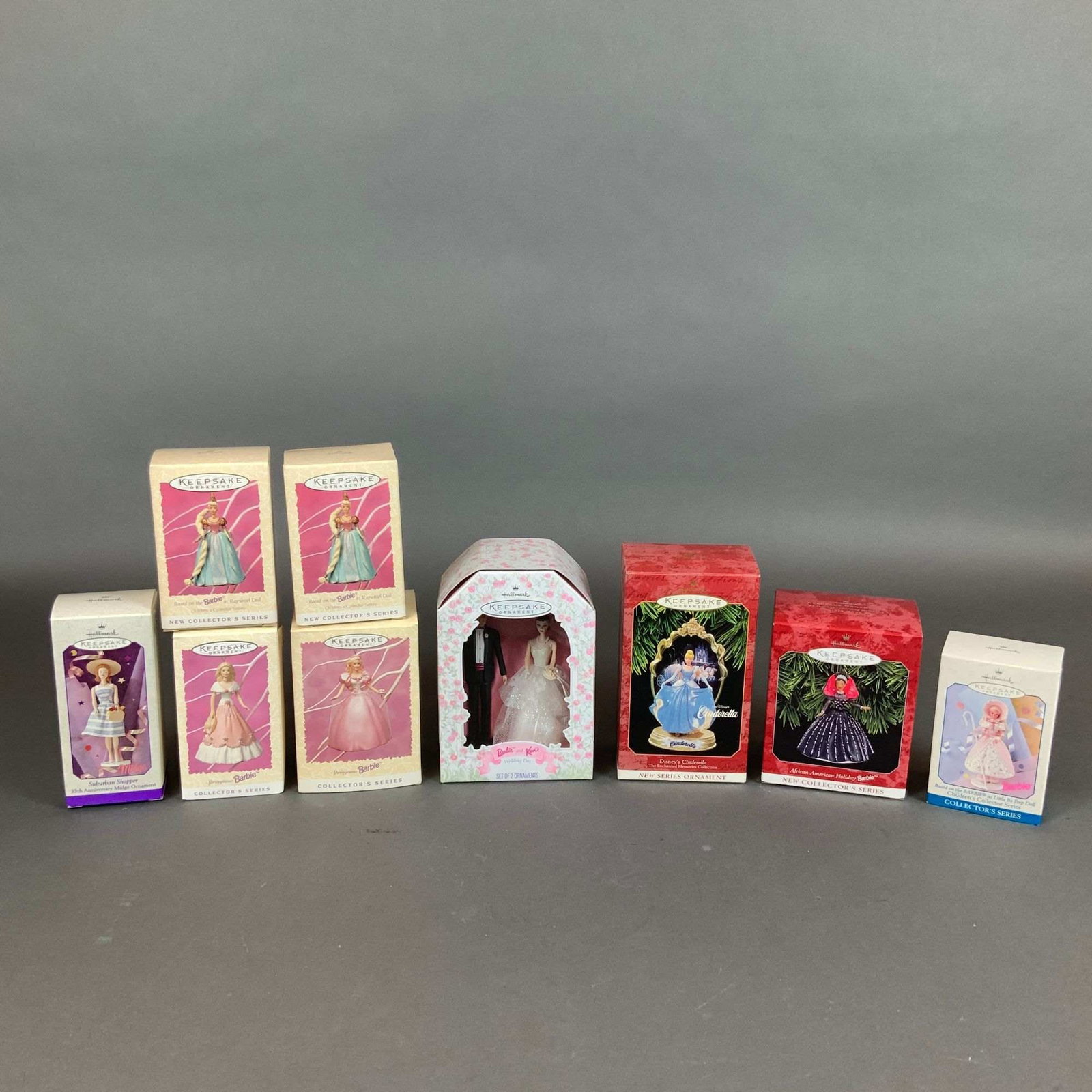 9pc Collection of Hallmark Keepsake Barbie and Disney Ornaments: This lot consists of a 9pc collection of Hallmark Keepsake ornaments produced between 1996 and 1998. The ornaments are manufactured from sculpted vinyl and plastic, with many featuring fabric accents 