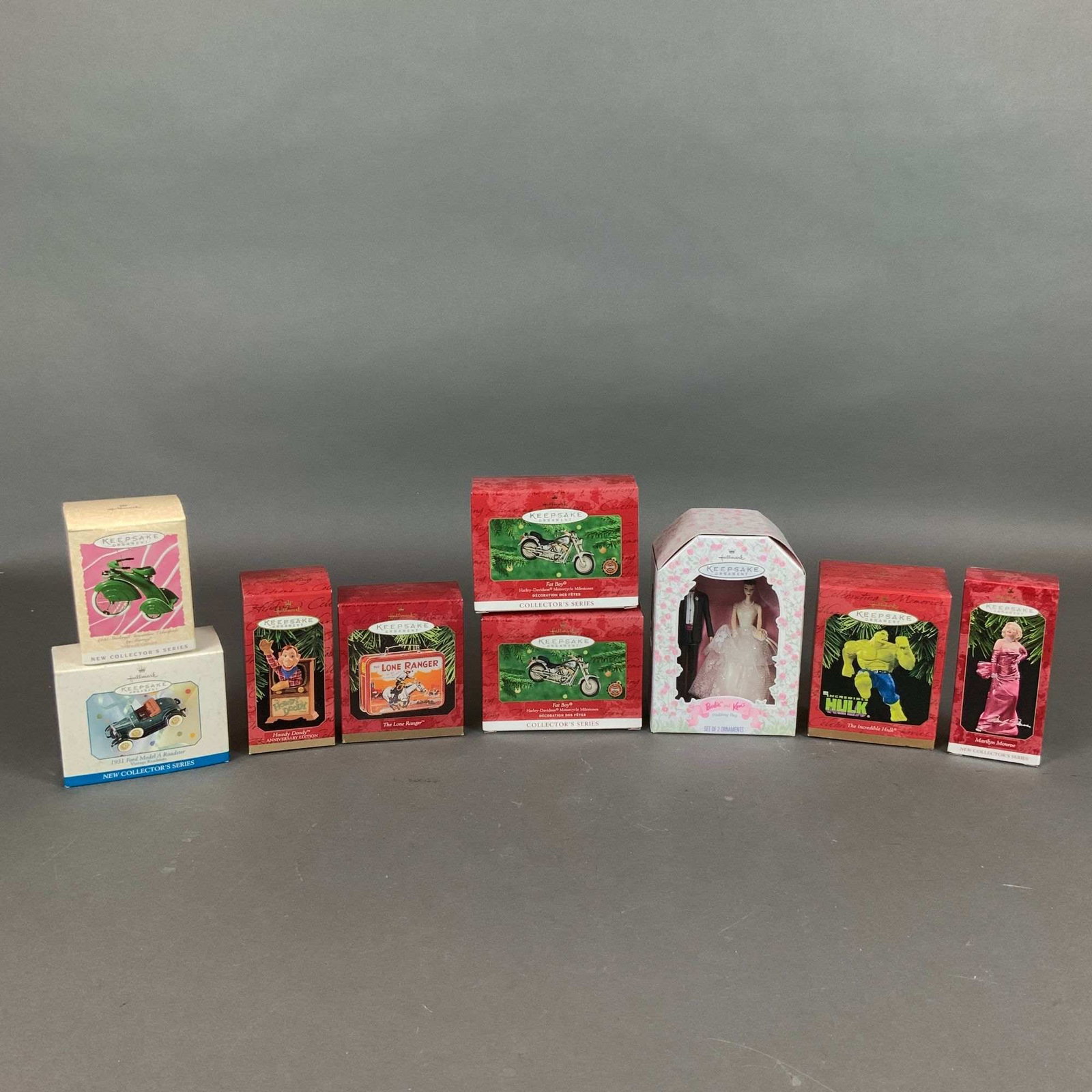 9pc Hallmark Keepsake Christmas Ornaments in Original Boxes: A collection of nine Hallmark Keepsake Christmas ornaments produced by Hallmark Cards, Inc. between 1997 and 2000. The group features various licensed themes and characters, constructed from materials