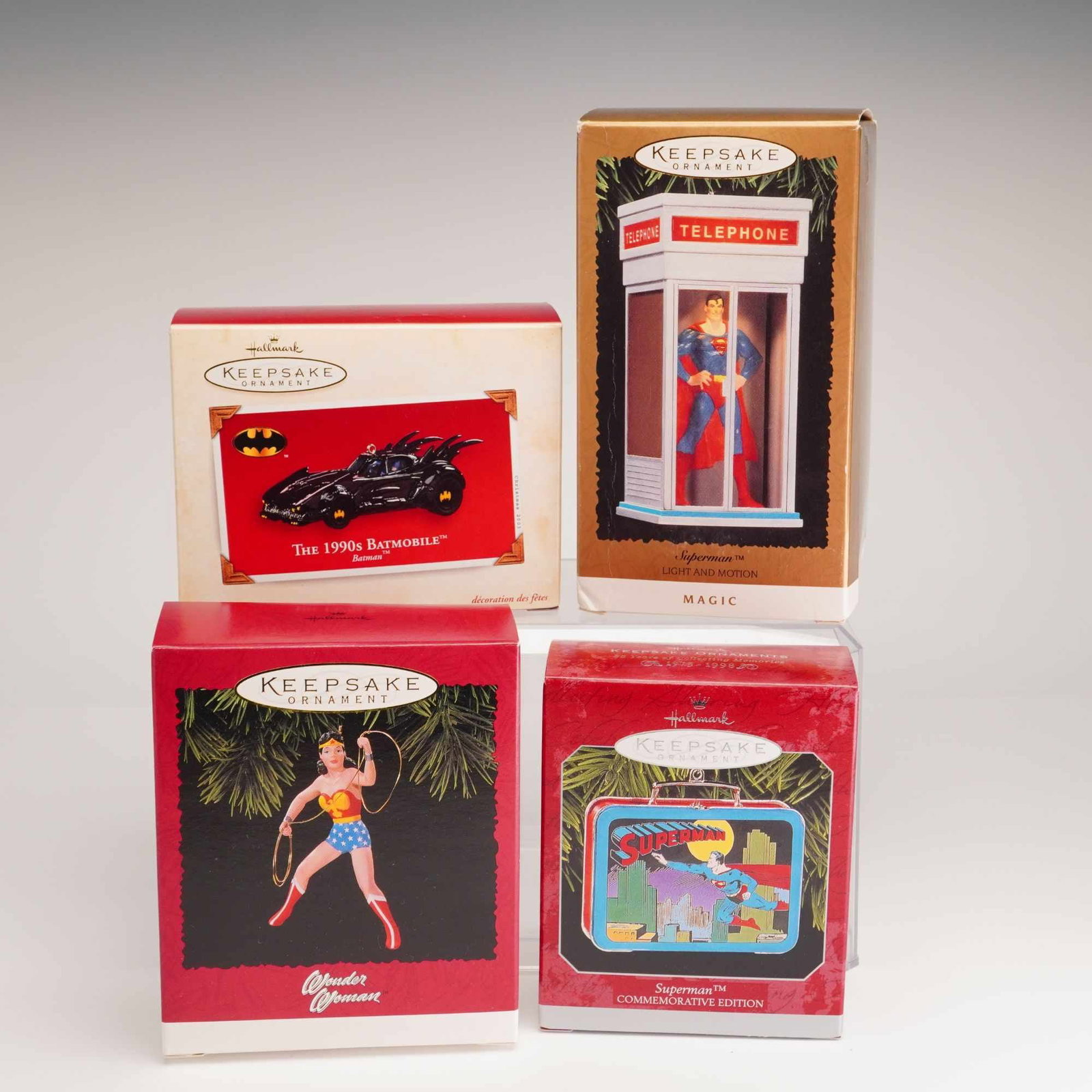 4pc Hallmark Keepsake DC Comics Ornaments: A set of four Hallmark Keepsake ornaments produced by Hallmark Cards, Inc., featuring various characters and icons from DC Comics. This collection consists of items from different series and years, al
