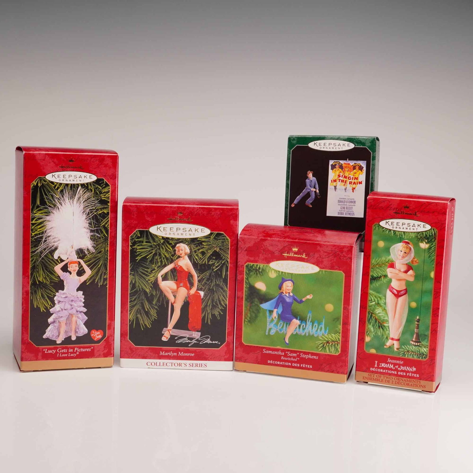 5pc Hallmark Keepsake Ornaments, Classic TV and Film: A collection of 5 Hallmark Keepsake Ornaments featuring iconic figures from classic television and film. The set includes "Lucy Gets in Pictures" from I Love Lucy (1999) sculpted by LaDene Votruba, a 