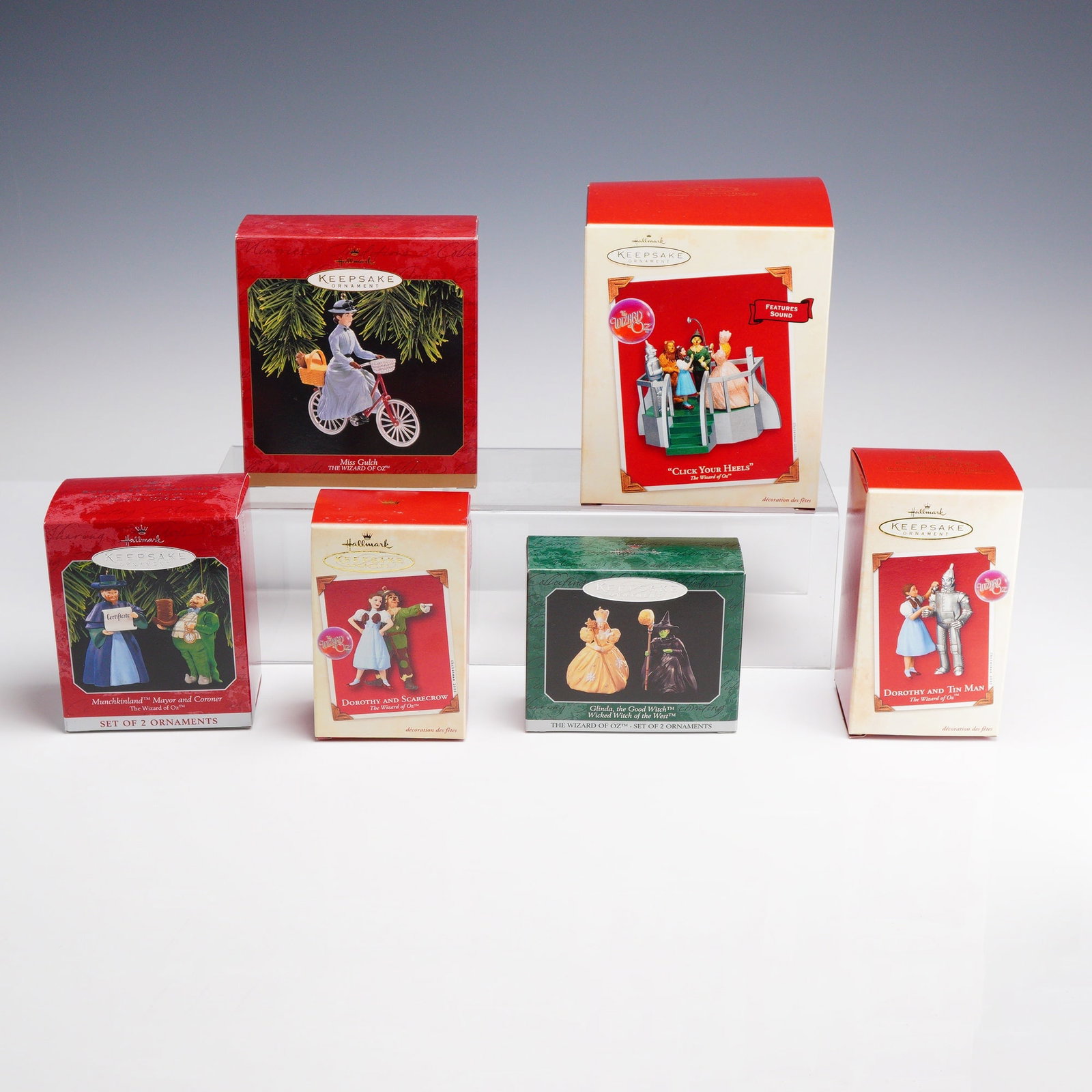 6pc Hallmark Keepsake Ornaments, Characters from The Wizard of Oz: This lot consists of a collection of Hallmark Keepsake Ornaments, specifically featuring characters and scenes from the classic film The Wizard of Oz. These handcrafted holiday ornaments are construct