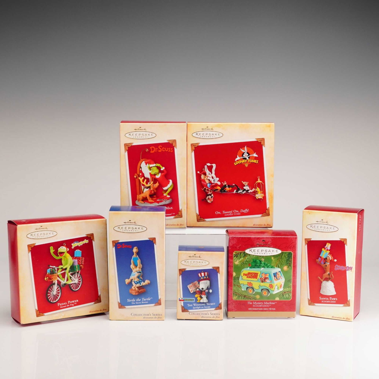 7pc Hallmark Keepsake Ornaments, Cartoon Characters: This lot consists of seven Hallmark Keepsake Christmas ornaments featuring licensed cartoon characters, each presented in its original retail box. The group includes a selection of characters populari