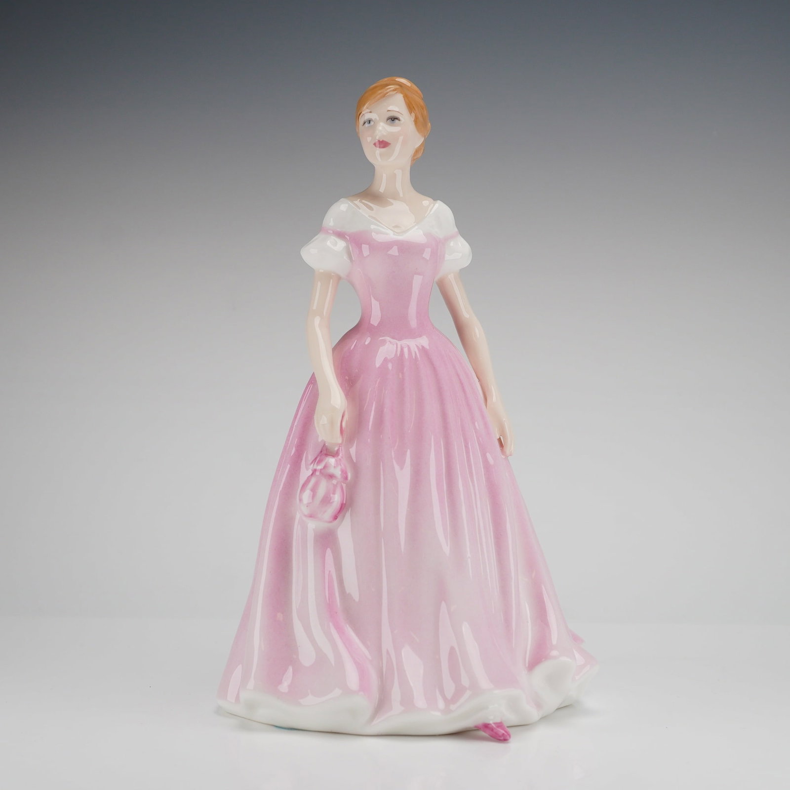 Royal Doulton Classics Love of Life HN 4529 Figurine: A single Royal Doulton Figurine, Love of Life HN4529, bone china, modeled by Martin K. Tabbey in 2003 and sold in support of breast cancer charities. Dimensions: 5.50"L x 5.00"W x 8.00"H Weight: 1.00 