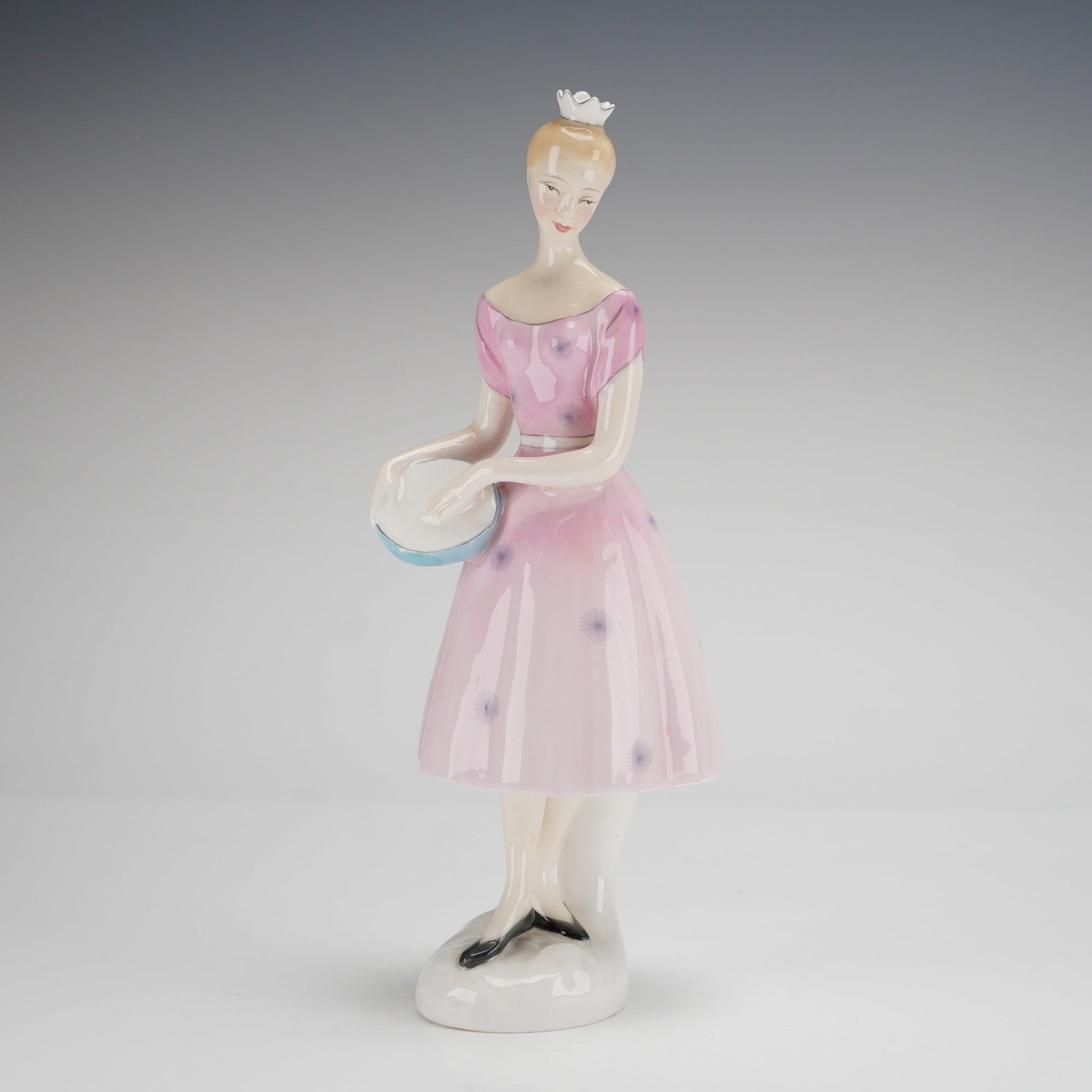 Royal Doulton Columbine HN 2185 Porcelain Figurine: A Royal Doulton bone china figurine titled Columbine, model number HN 2185. This mid-century modern style piece depicts a slender female figure wearing a pink off-the-shoulder dress decorated with pur