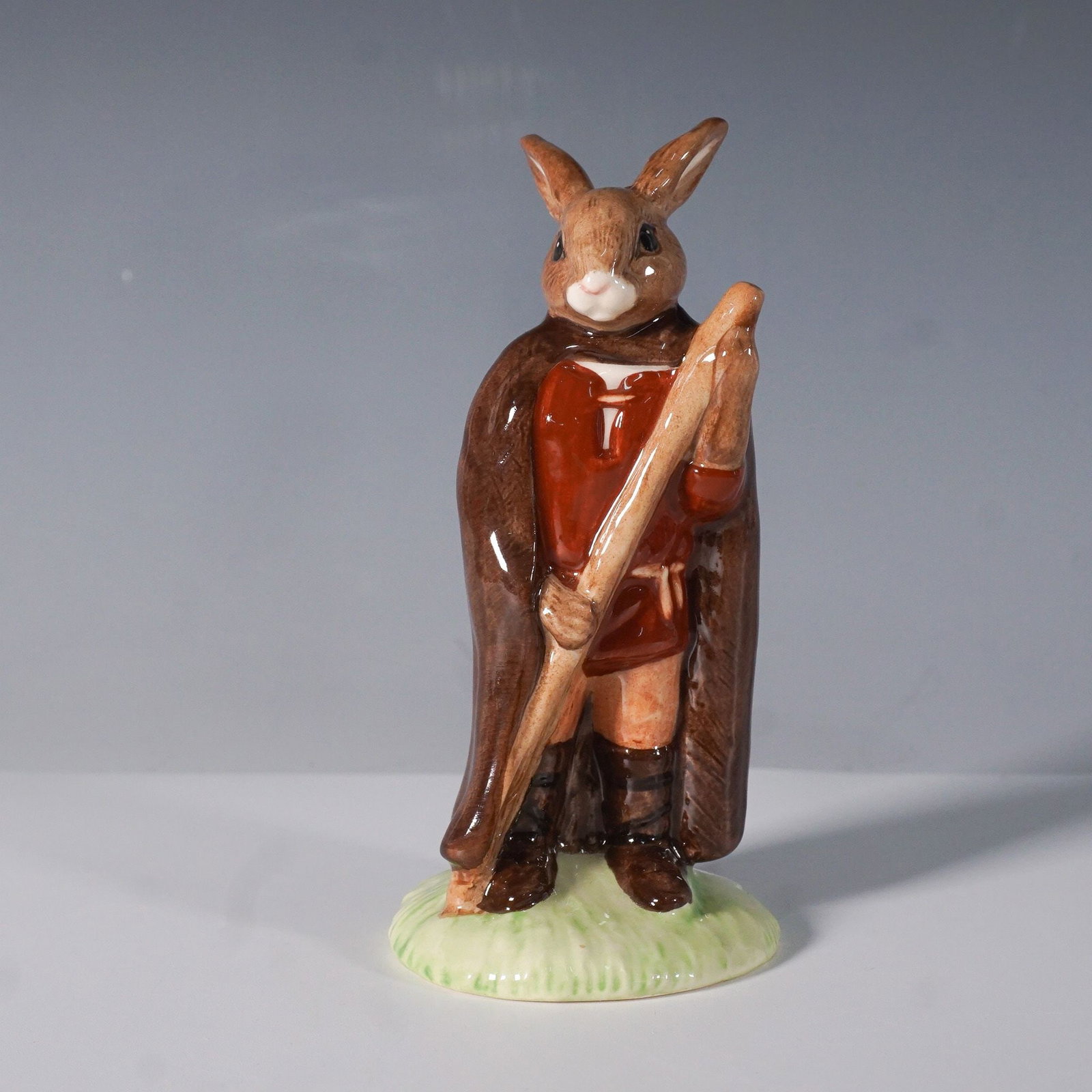 Royal Doulton Bunnykins Little John Figurine DB243: From Royal Doulton's beloved Bunnykins series, this hand-painted and hand-decorated porcelain figurine depicts Little John from The Robin Hood Collection. Designed with rich earthy tones, this charmin