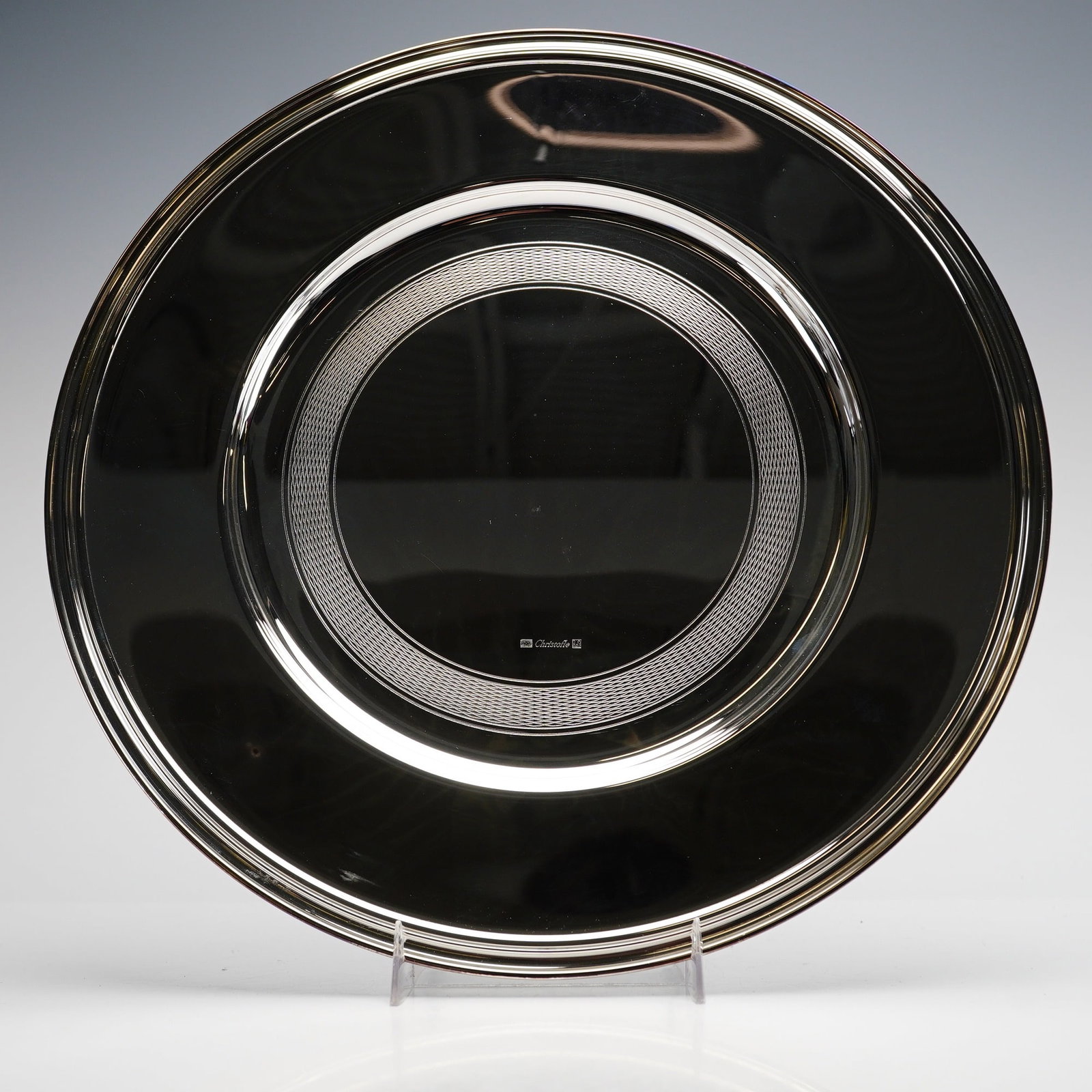 Christofle Albi Pattern Silver-Plated Service Plate with Engine-Turned Center: Christofle silver-plated service plate or underplate in the Albi pattern. This circular platter features a wide, flat rim with a mirror-polished finish. The shallow central well is distinguished by a 