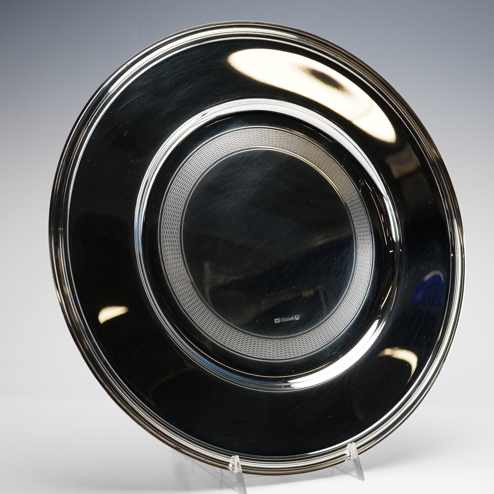 Christofle Silver-Plated Charger Presentation Plate, Albi: This Christofle silver-plated charger or presentation plate is from the Albi collection, a design created in 1968 inspired by the clean architectural lines of the Albi Cathedral in France. The circula
