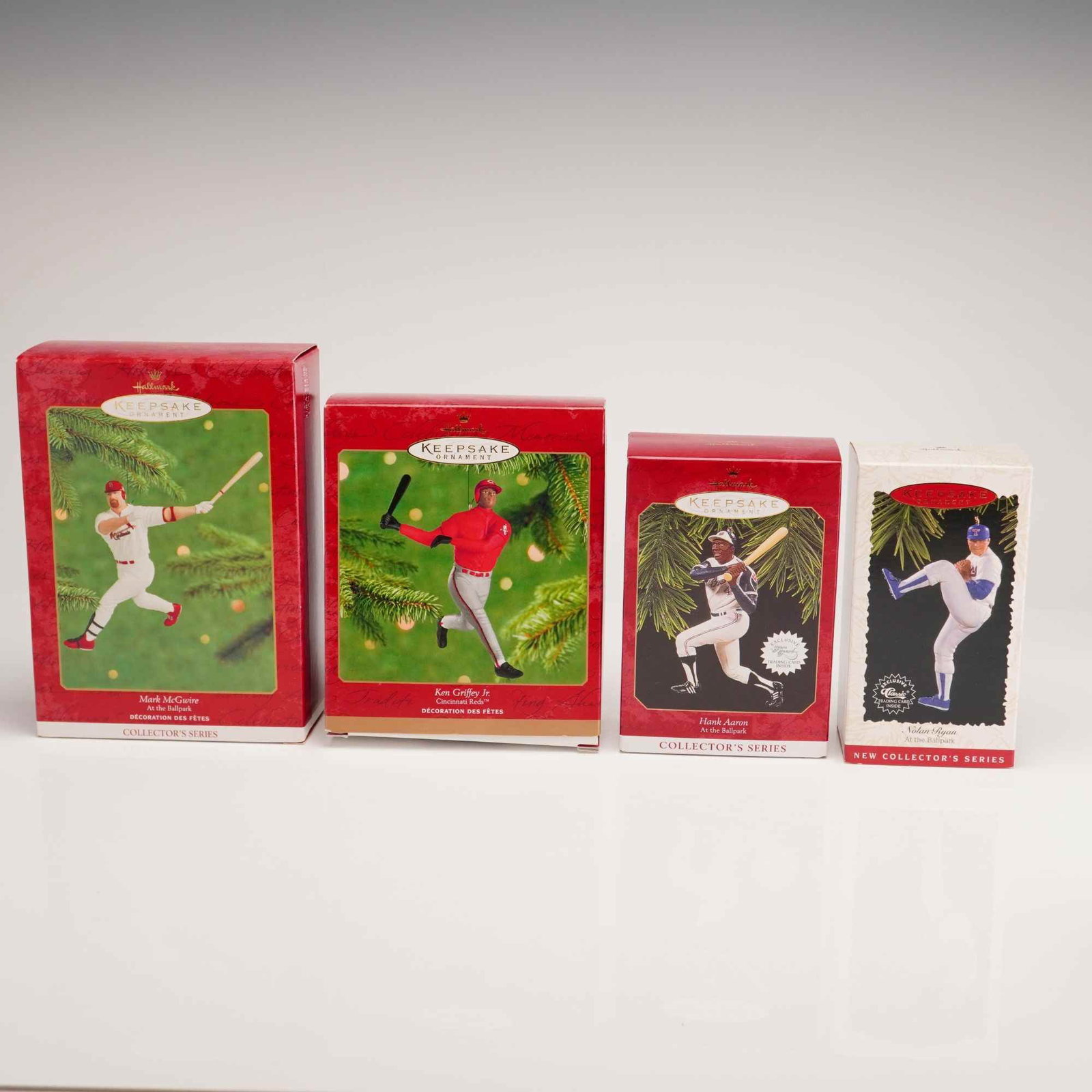 4pc Hallmark Keepsake MLB Baseball Ornaments: A lot of four Hallmark Keepsake Christmas ornaments featuring Major League Baseball legends. Each ornament was sculpted by artist Dill Rhodus and is housed in its original retail collector box. The co