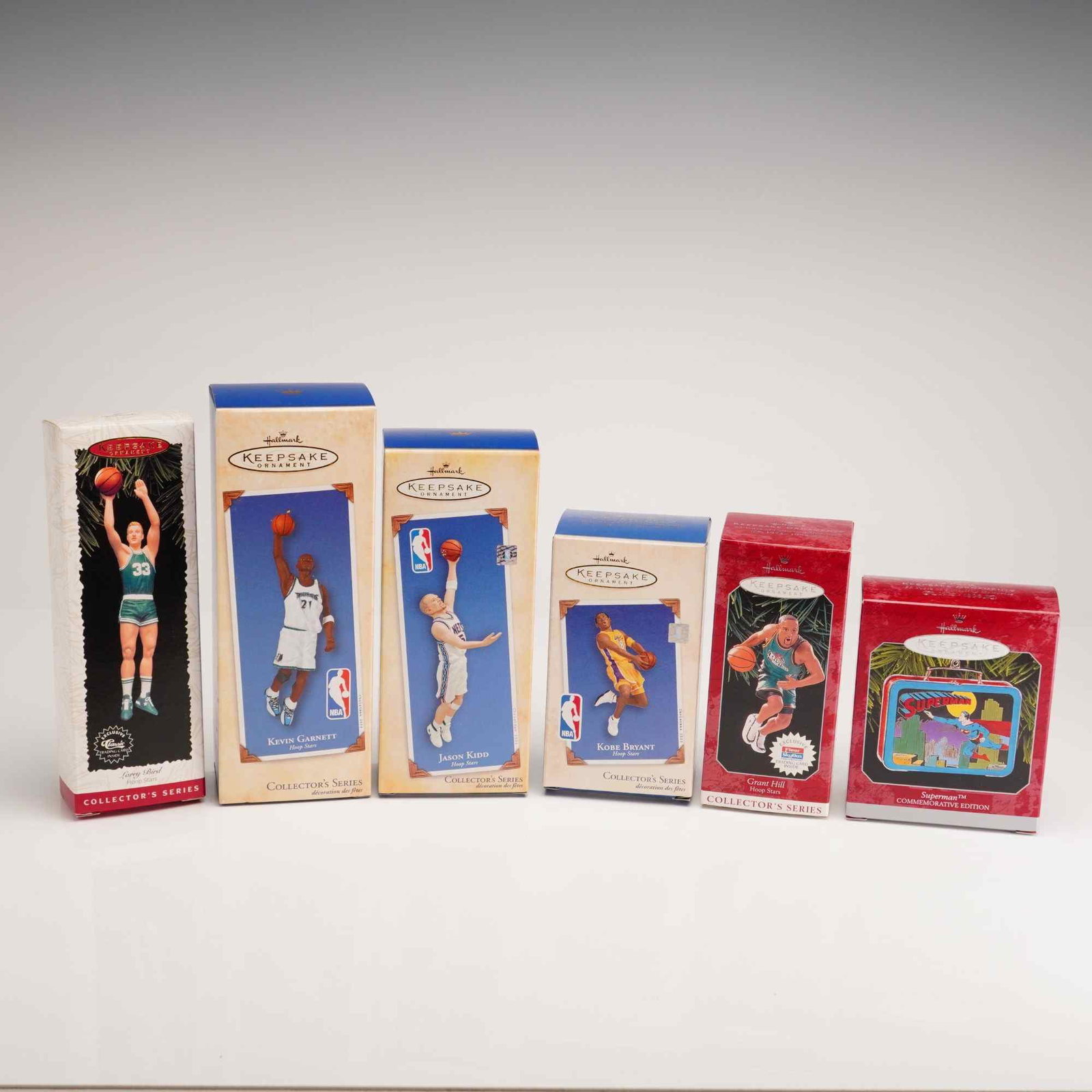 6pc Hallmark Keepsake Ornaments Basketball and Superman: A collection of six Hallmark Keepsake Ornaments, featuring five entries from the Hoop Stars basketball series and one Superman commemorative edition. All ornaments are housed in their original retail 