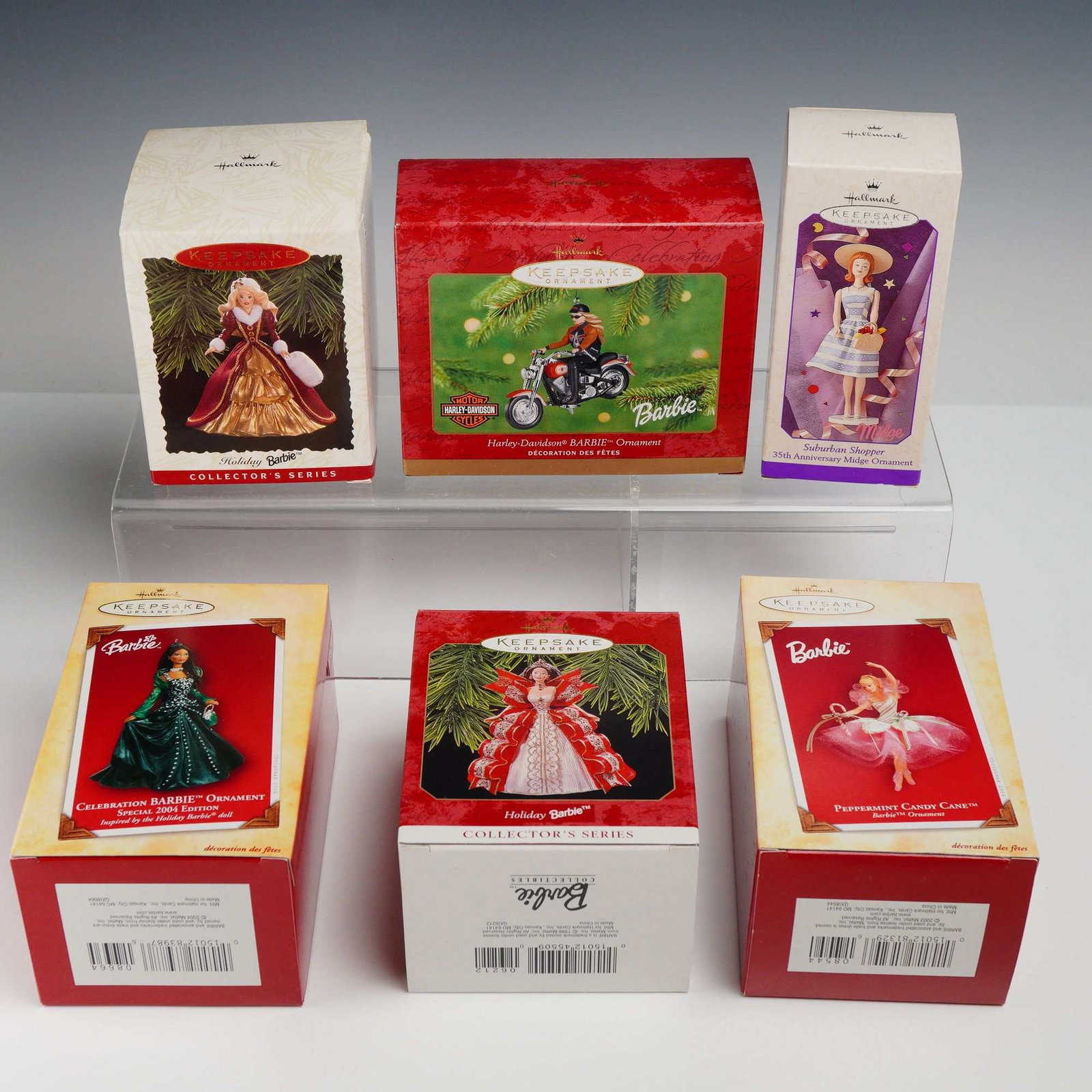 6pc Hallmark Keepsake Barbie Collection Ornaments in Original Packaging: A collection of six Hallmark Keepsake Barbie collection ornaments, each housed in its original retail box. This group features various releases from the 1990s and early 2000s. The ornaments are primar
