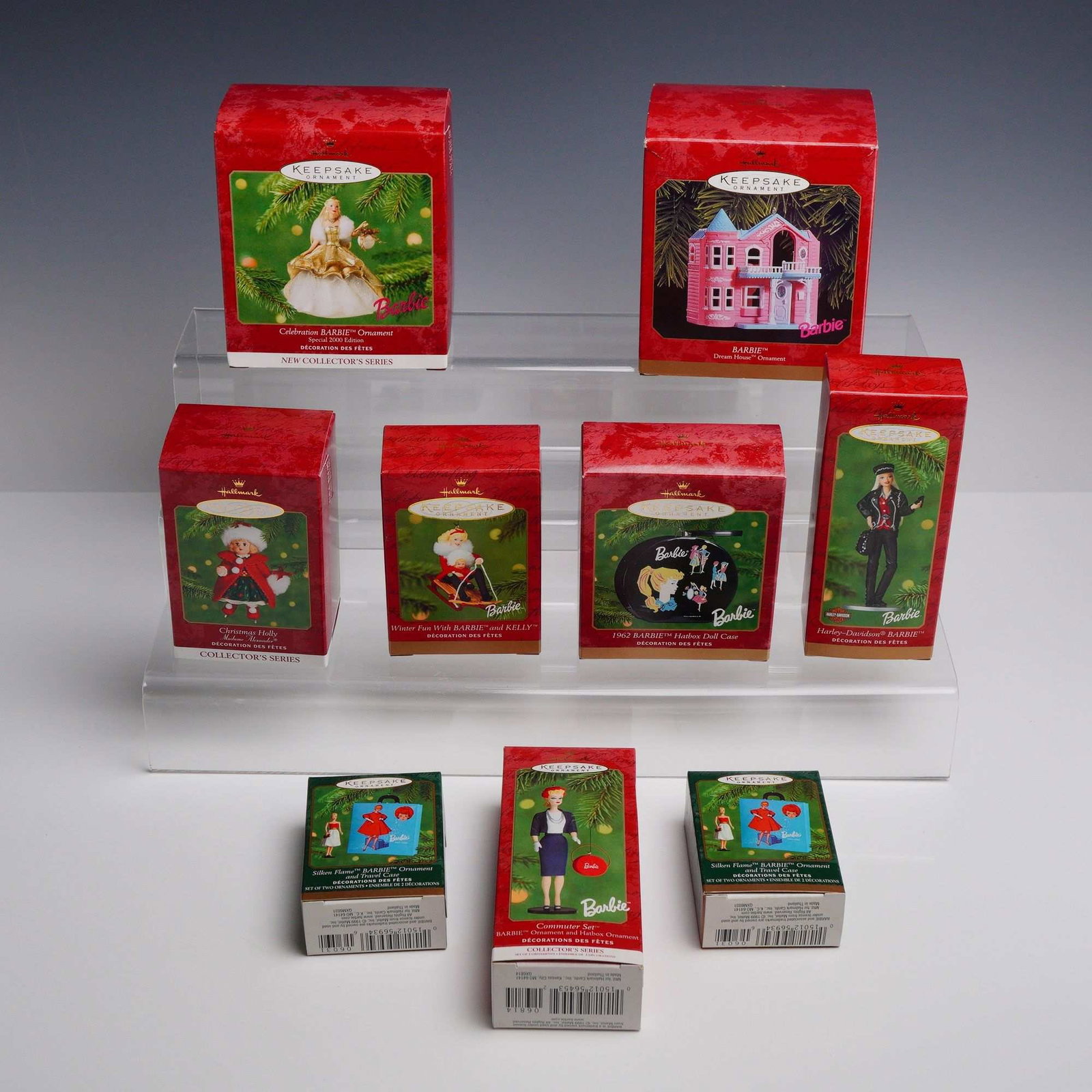 9pc Hallmark Keepsake Barbie and Madame Alexander Ornaments: An assortment of 9Hallmark Keepsake collectible ornaments featuring various Barbie and Madame Alexander designs from 1999 and 2000. Each item is housed in its original color-printed retail packaging. 