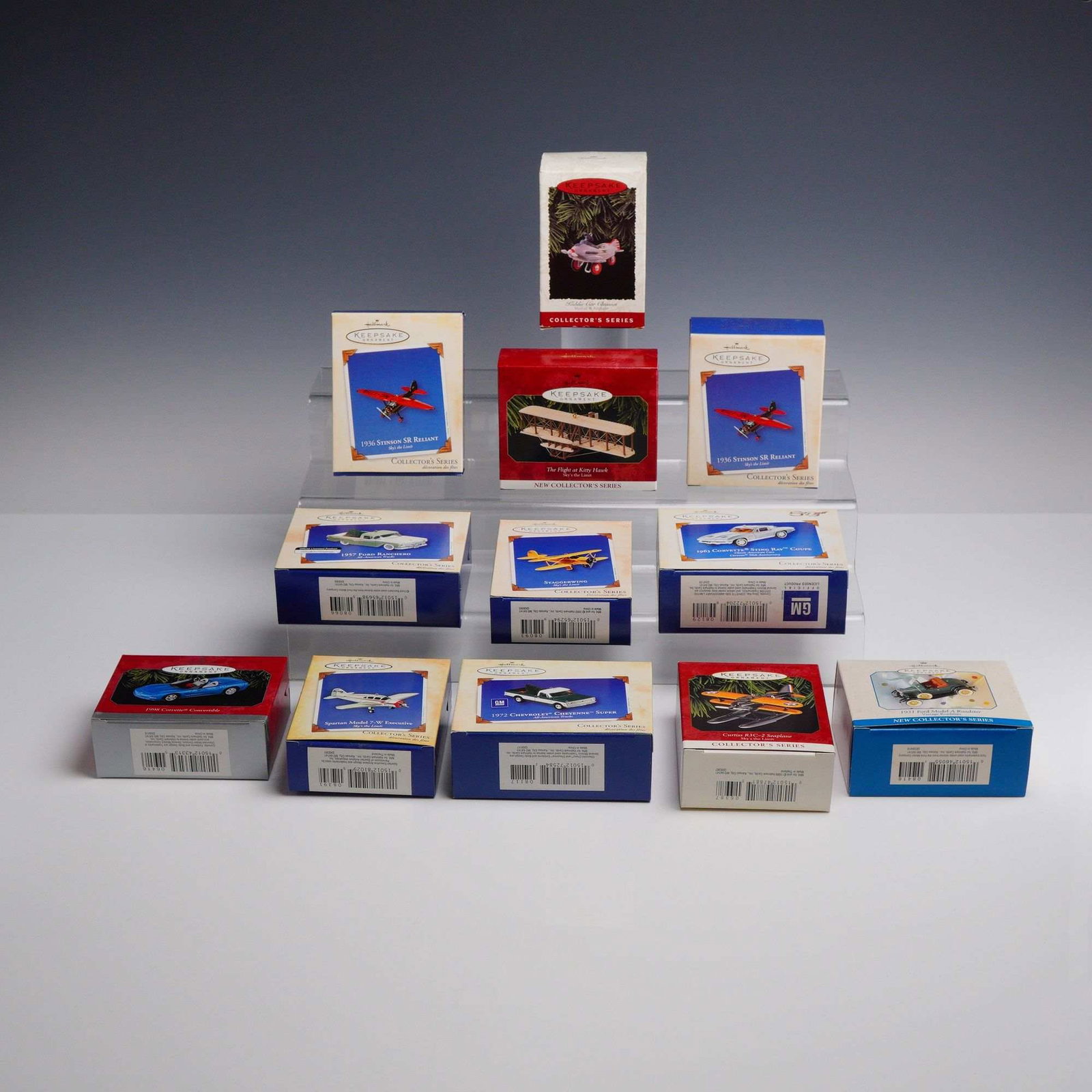12pc Hallmark Keepsake Collectible Ornaments: This lot of twelve Hallmark Keepsake ornaments includes a variety of vintage-style aircraft and classic automobiles primarily from the Sky's the Limit, Collector's Series, All-American Trucks, and