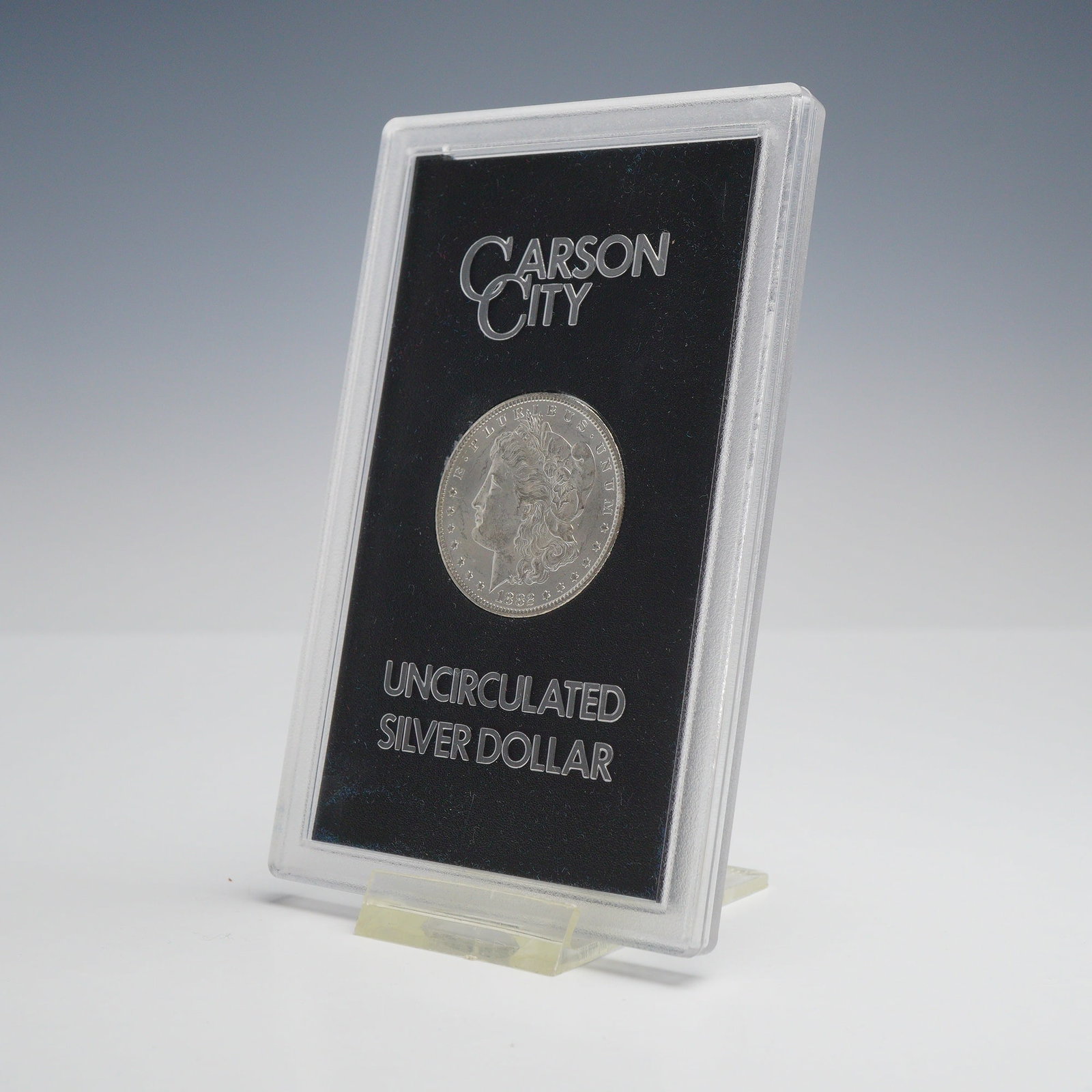 1882-CC US Carson City Mint Morgan Silver Dollar: This lot consists of an 1882 Morgan Silver Dollar struck at the Carson City Mint, identified by the CC mint mark on the reverse. The coin is a 90 percent silver issues from the General Services Admini