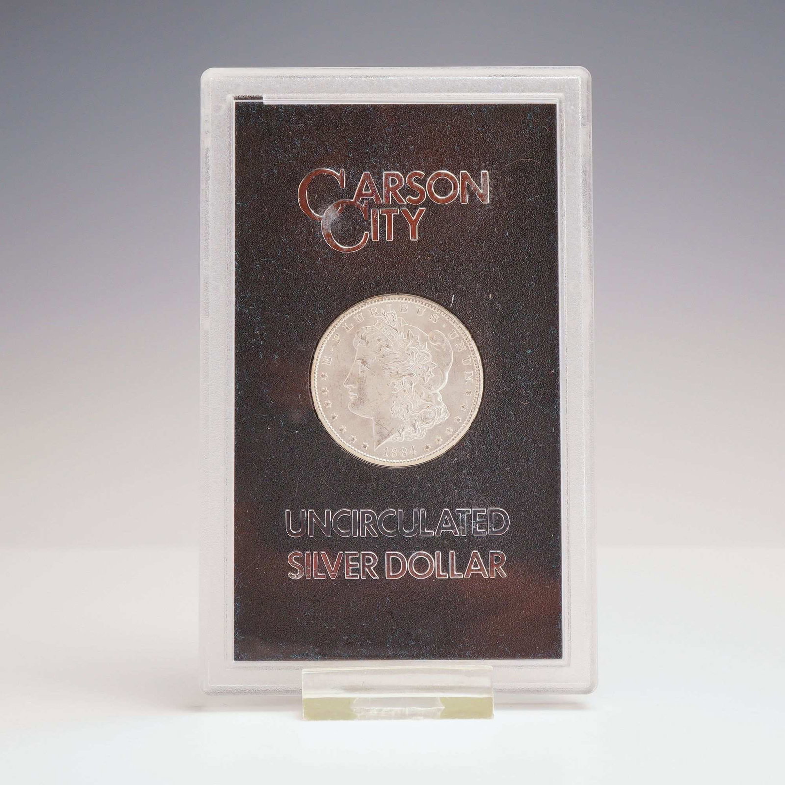 1884-CC US Carson City Mint Morgan Silver Dollar: This 1884-CC Morgan silver dollar was struck at the Carson City Mint in a composition of 90 percent silver and 10 percent copper. The coin features the Liberty head obverse and the heraldic eagle reve