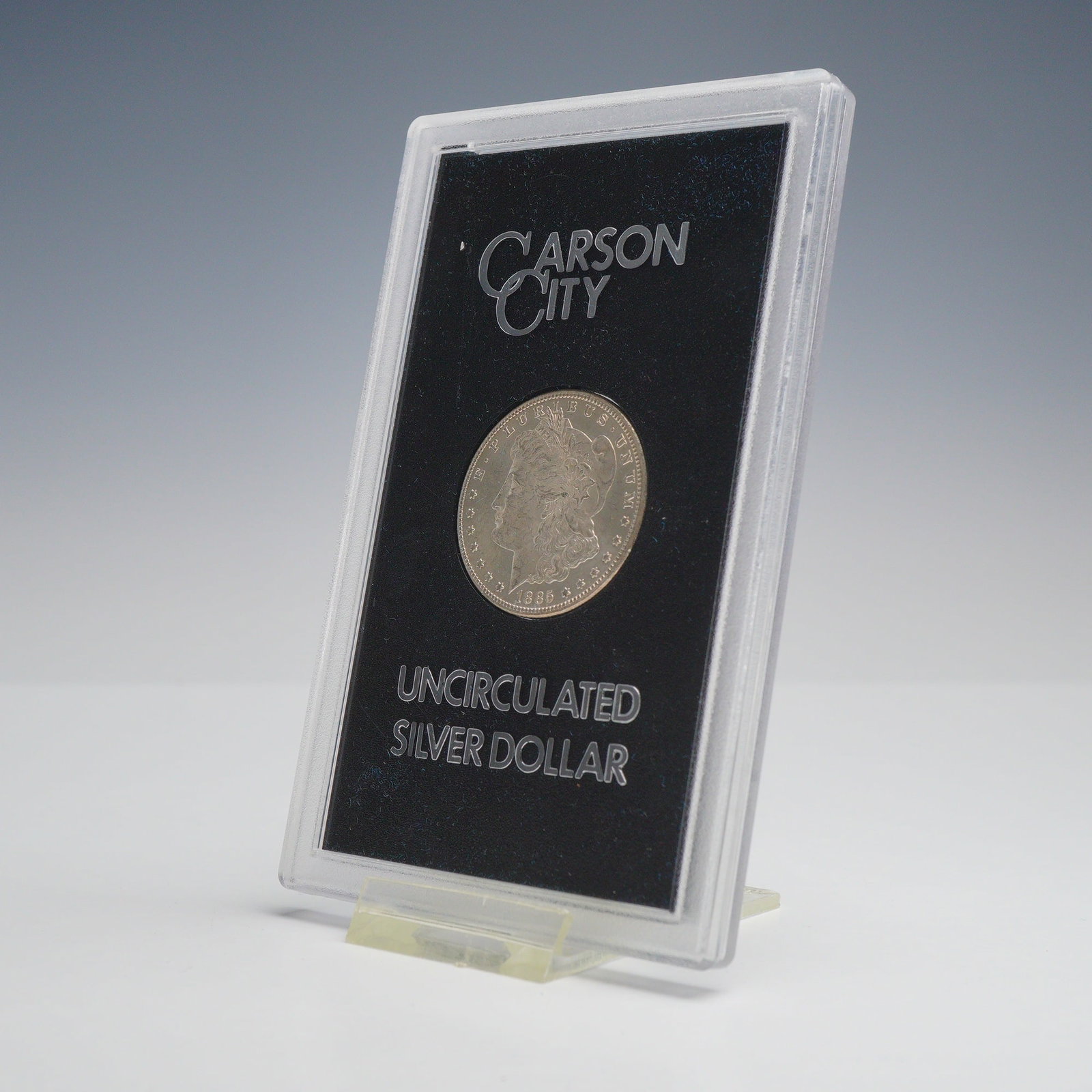 1885-CC US Carson City Mint Morgan Silver Dollar: 1885-CC Morgan silver dollar issued by the General Services Administration as part of the GSA government hoard. Struck at the Carson City Mint, this coin is housed in its original GSA hard plastic hol