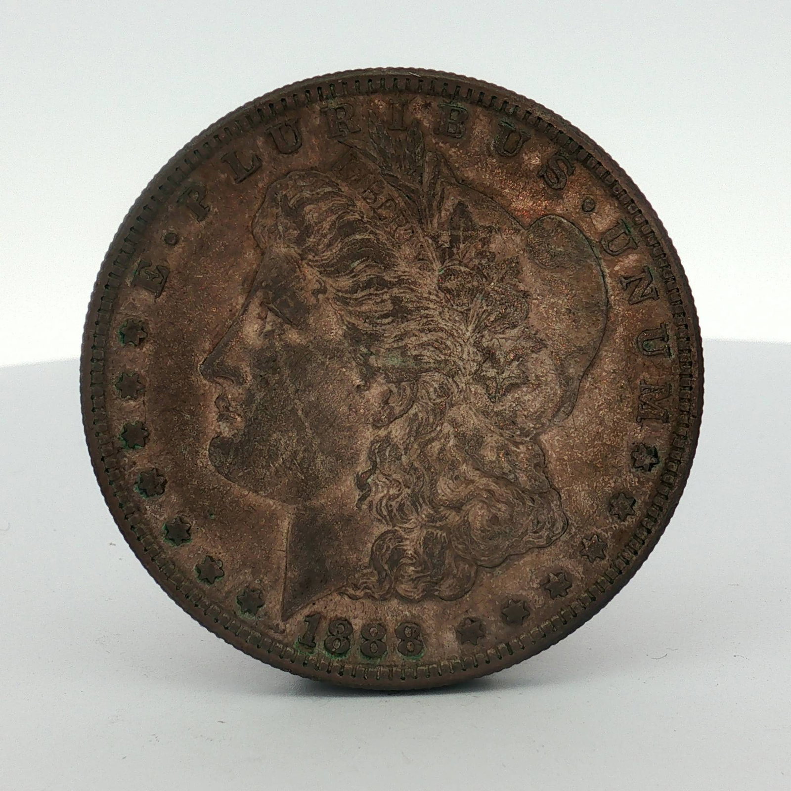 1888-S US Morgan Silver Dollar: 1888-S US Morgan silver dollar. This coin was struck at the San Francisco Mint and features the standard design by George T. Morgan. It is composed of 90 percent silver and 10 percent copper. The obve